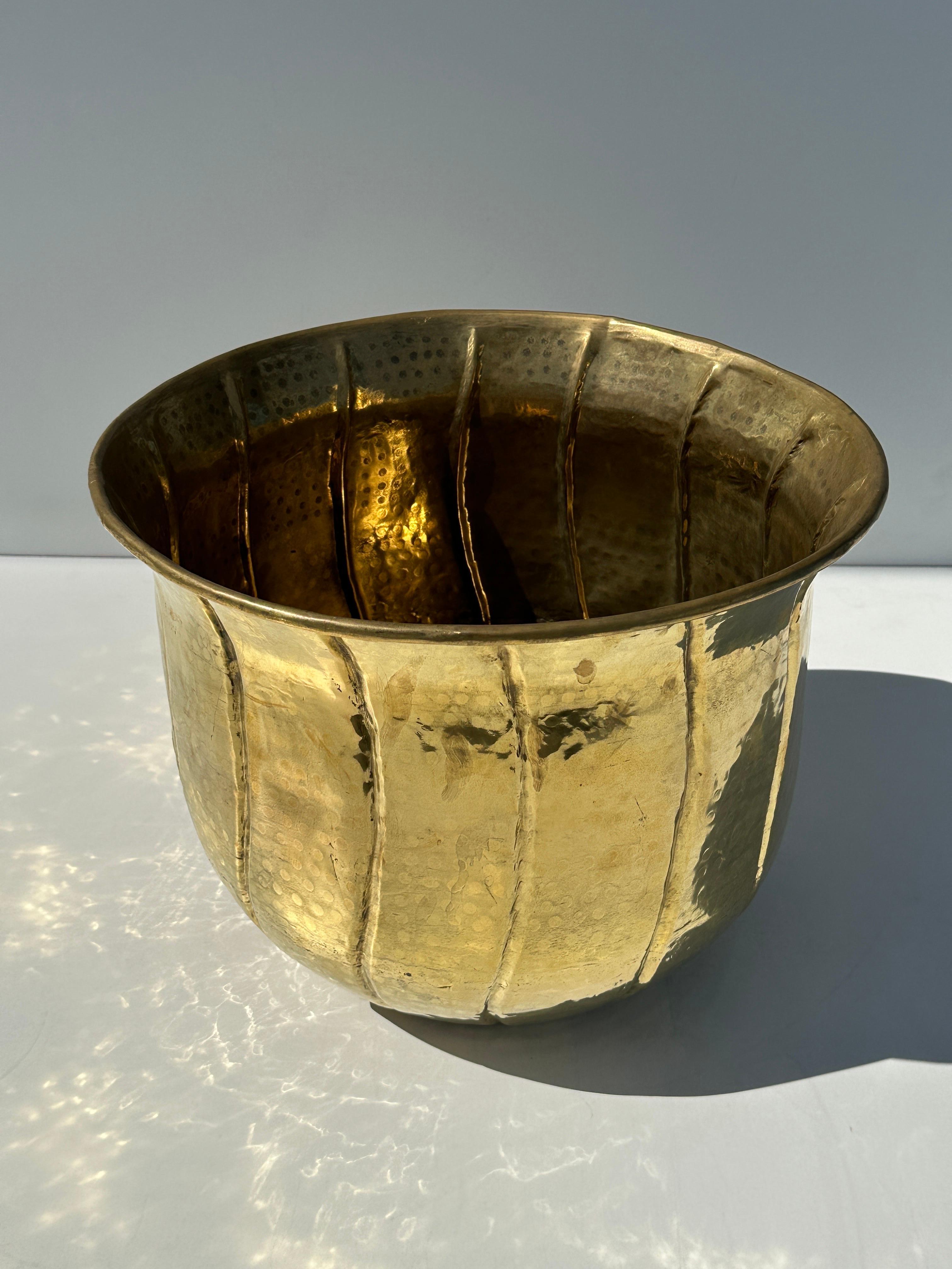 Large hand hammered brass planter. We also have matching extra large and medium planters available shown in last photo.