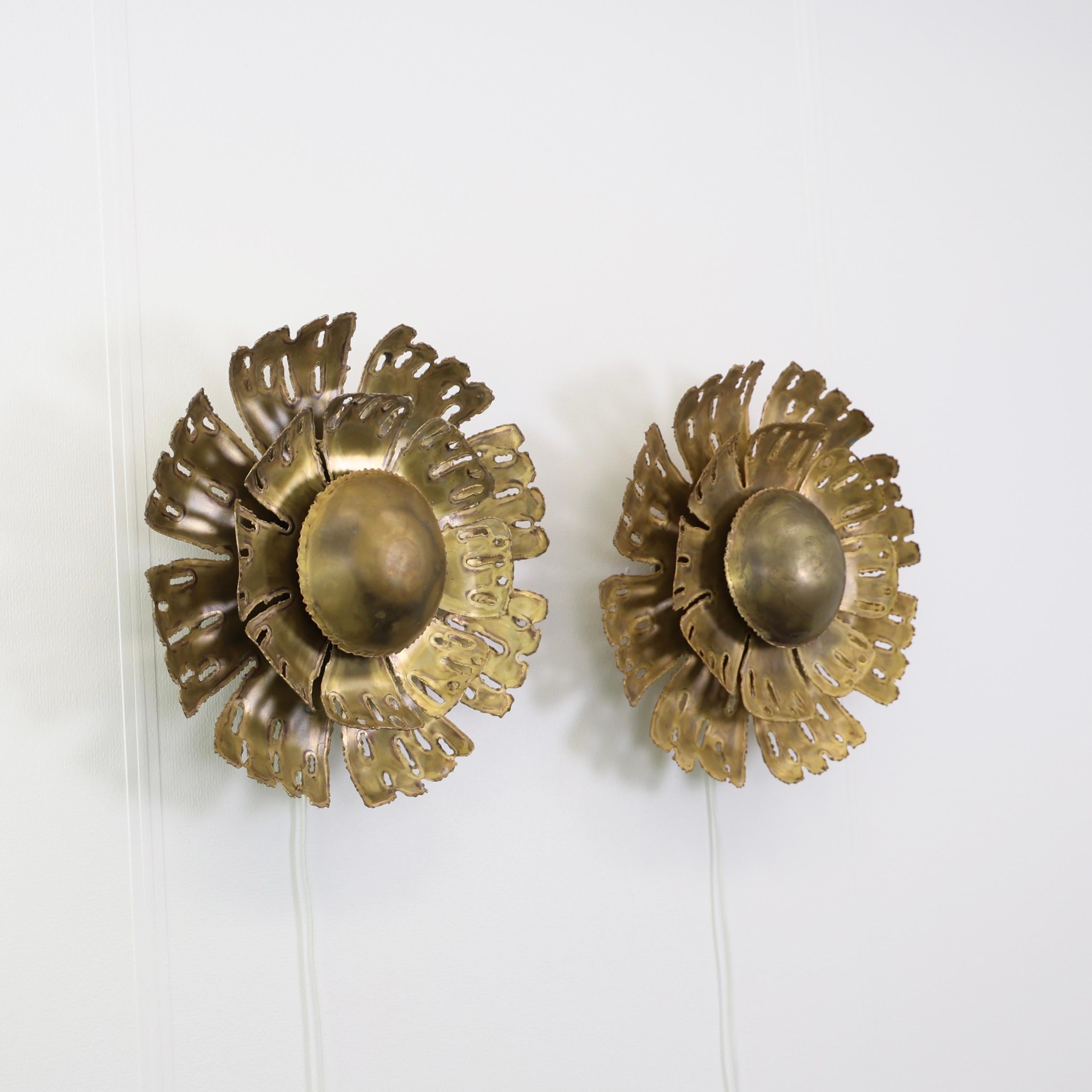 Set of Substantial Brass Wall Lamps designed by Svend Aage Holm Sørensen in the 1960s. 

* Set (2) of flame-cut sun-shaped brass sconces
* Designer: Svend Aage Holm Sorensen
* Model: 5207
* Manufacturer: Holm Sørensen & Co.
* Year: 1960s
*
