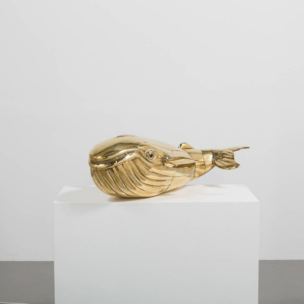 Large highly polished brass Humpback whale designed by Sergio Bustamante. This piece has excellent detail and would make a great statement piece in any home. 

Sergio Bustamante is a Mexican Artist and sculptor. He began with paintings and papier