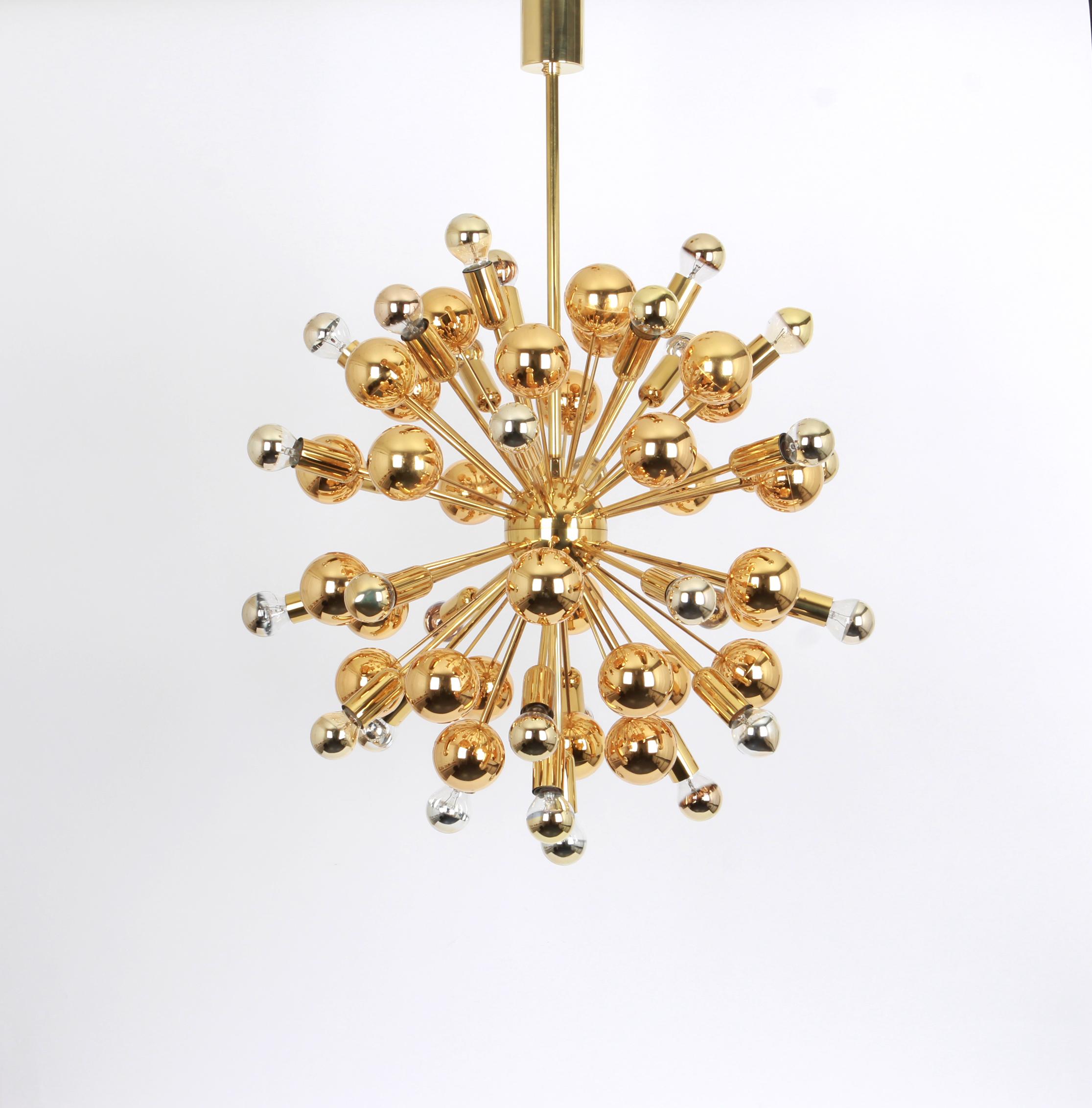 Exclusive and rare brass Sputnik pendant lamp designed by Cosack during the 1970s.

Sockets: It needs 31 x E14 small bulb and function on voltage from 110 till 240 volts.
Dimensions: 
Diameter: 24