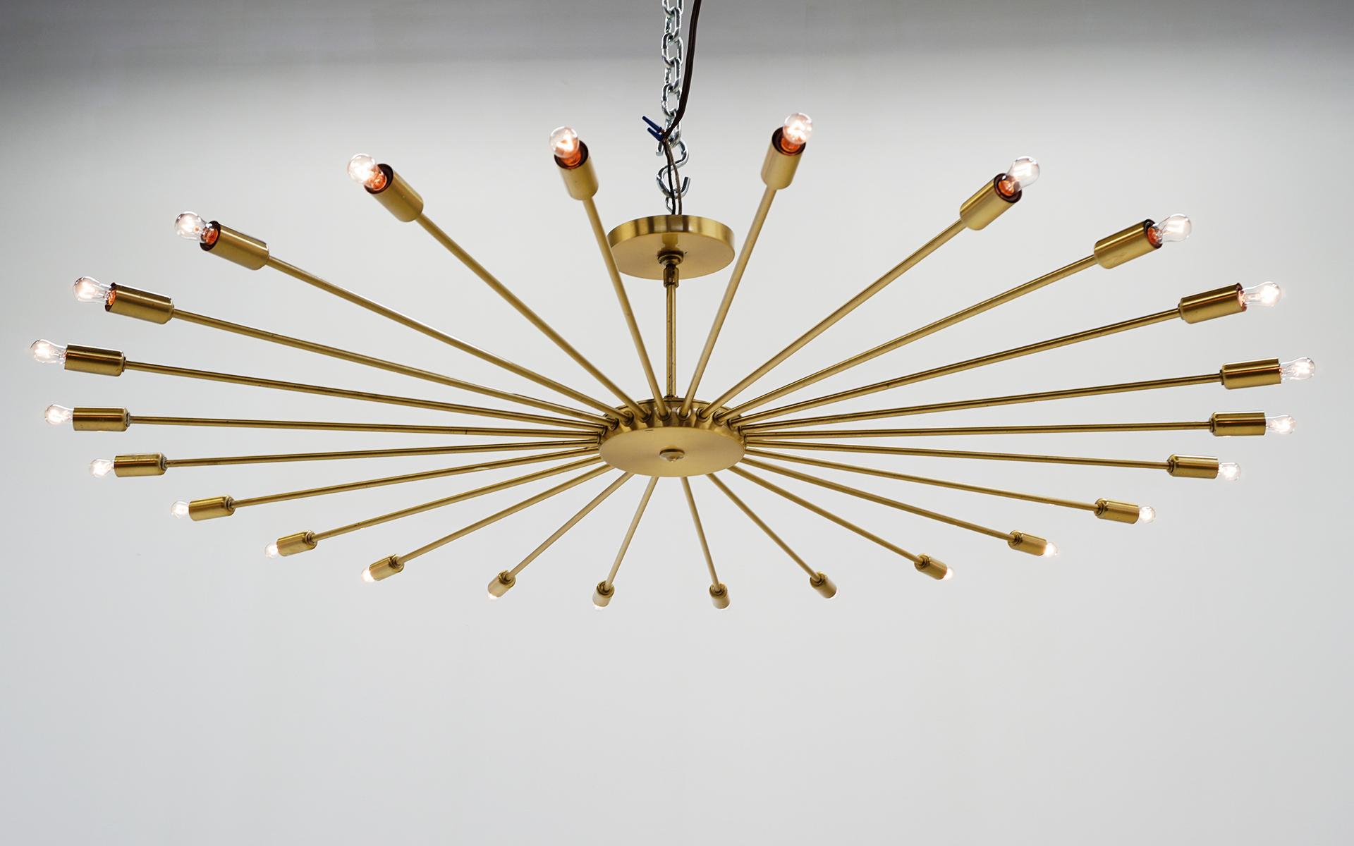 Brass twenty four arm Sputnik light fixture / chandelier. Very good original condition. 24 lights. The current original stem is eight inches long and the light is forty four inches in diameter. Completely original 1950s and in very good working