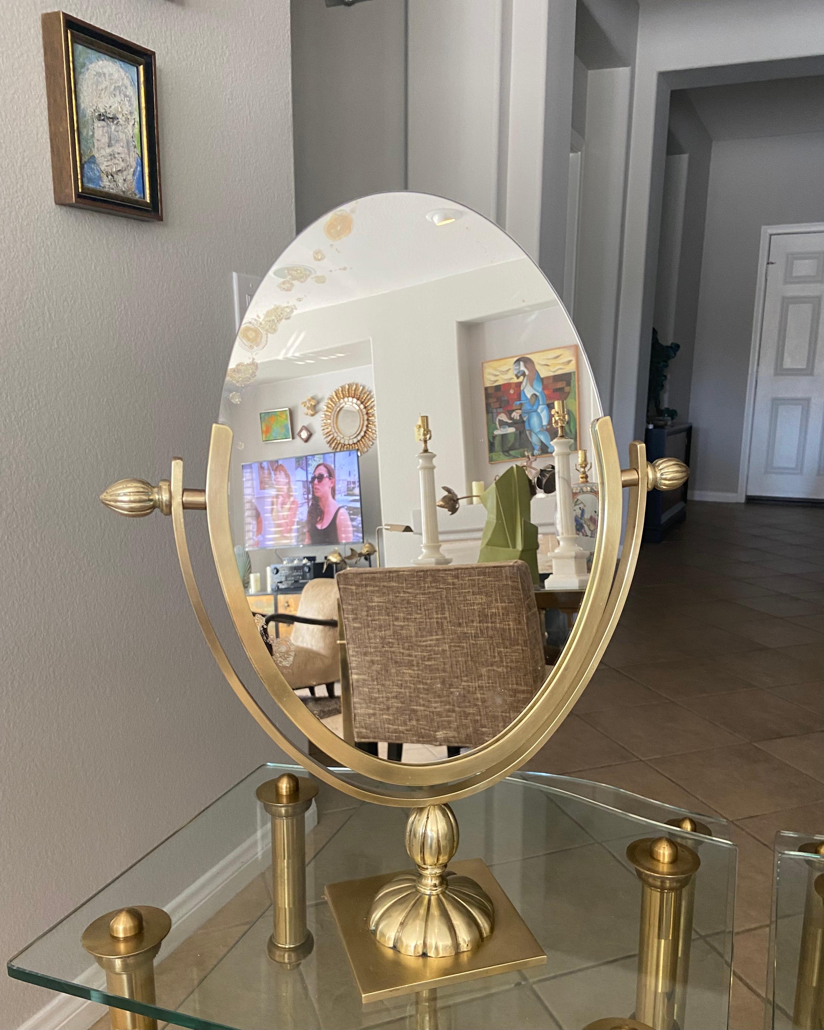 Large solid brass oval double sided swivel vanity table mirror.