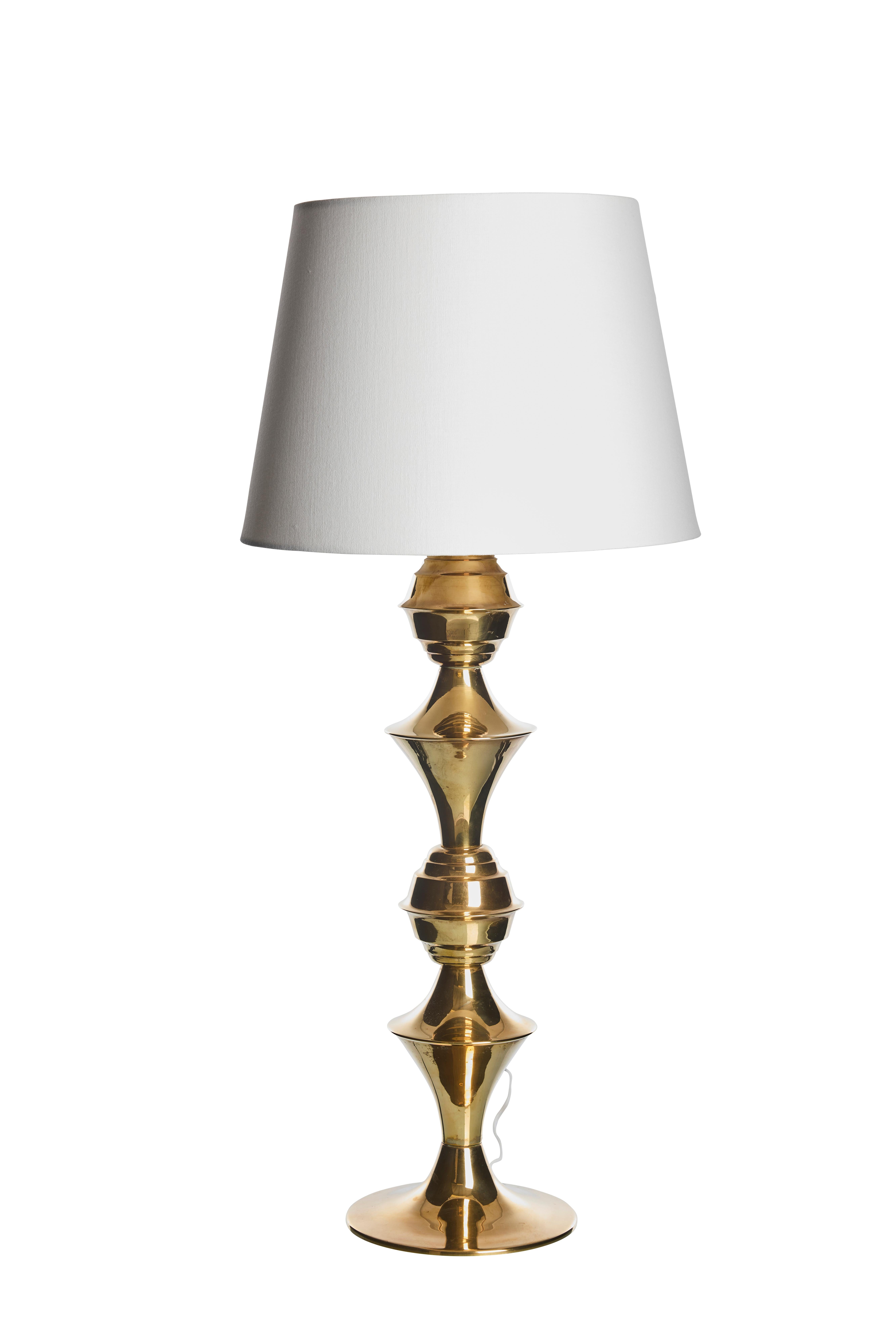 Whether placed on a bedside table, a desk, or a living room console, this vintage table lamp stands out as both a functional lighting solution and a statement piece. Its enduring design and superior craftsmanship make it a cherished addition to any