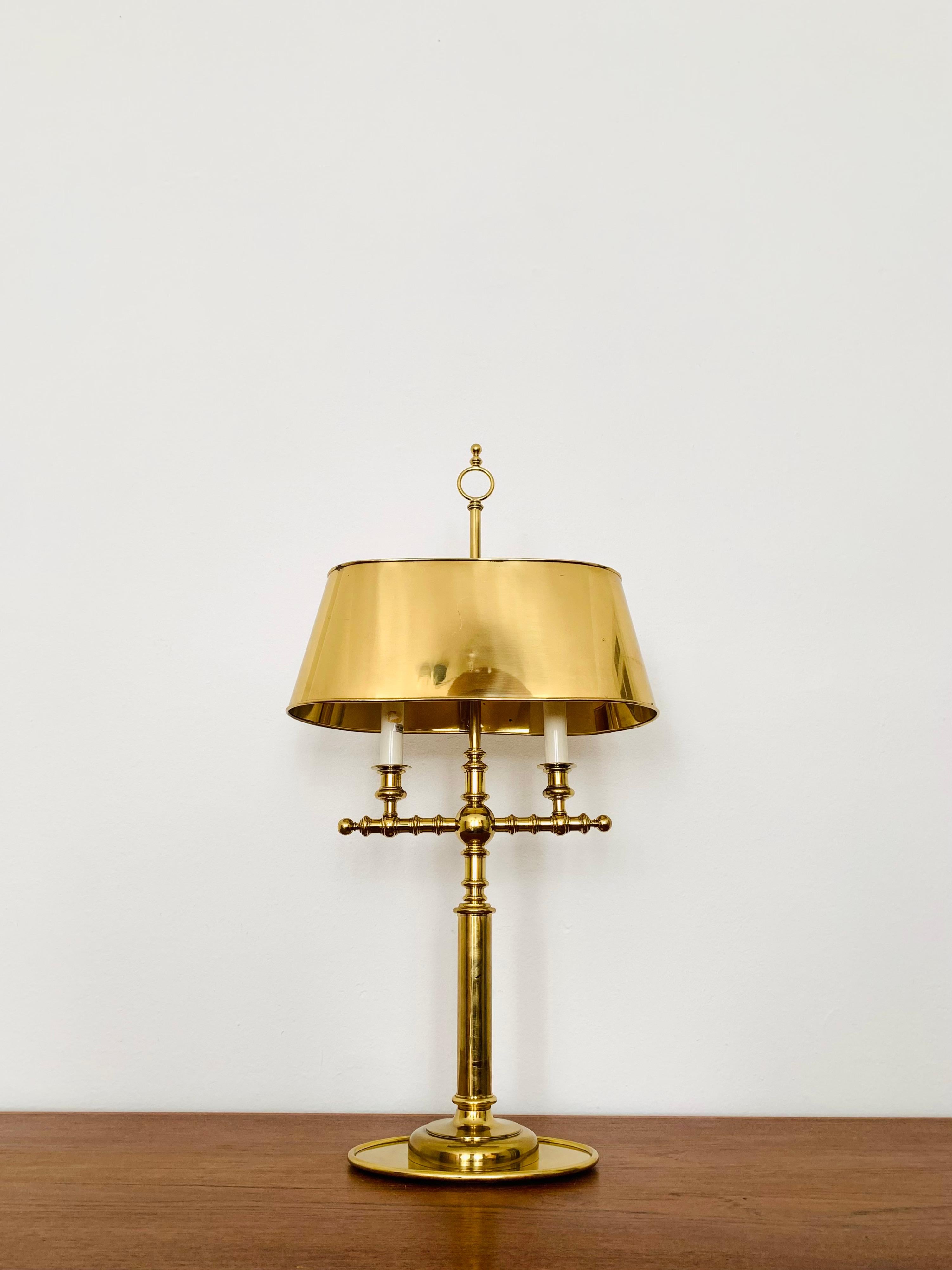Impressive brass table lamp from the 1960s.
Exceptionally successful design and very high -quality workmanship.
The lampshade is adjustable in height.
A very noble lamp and an enrichment for every home.

Condition:

Very good vintage condition with