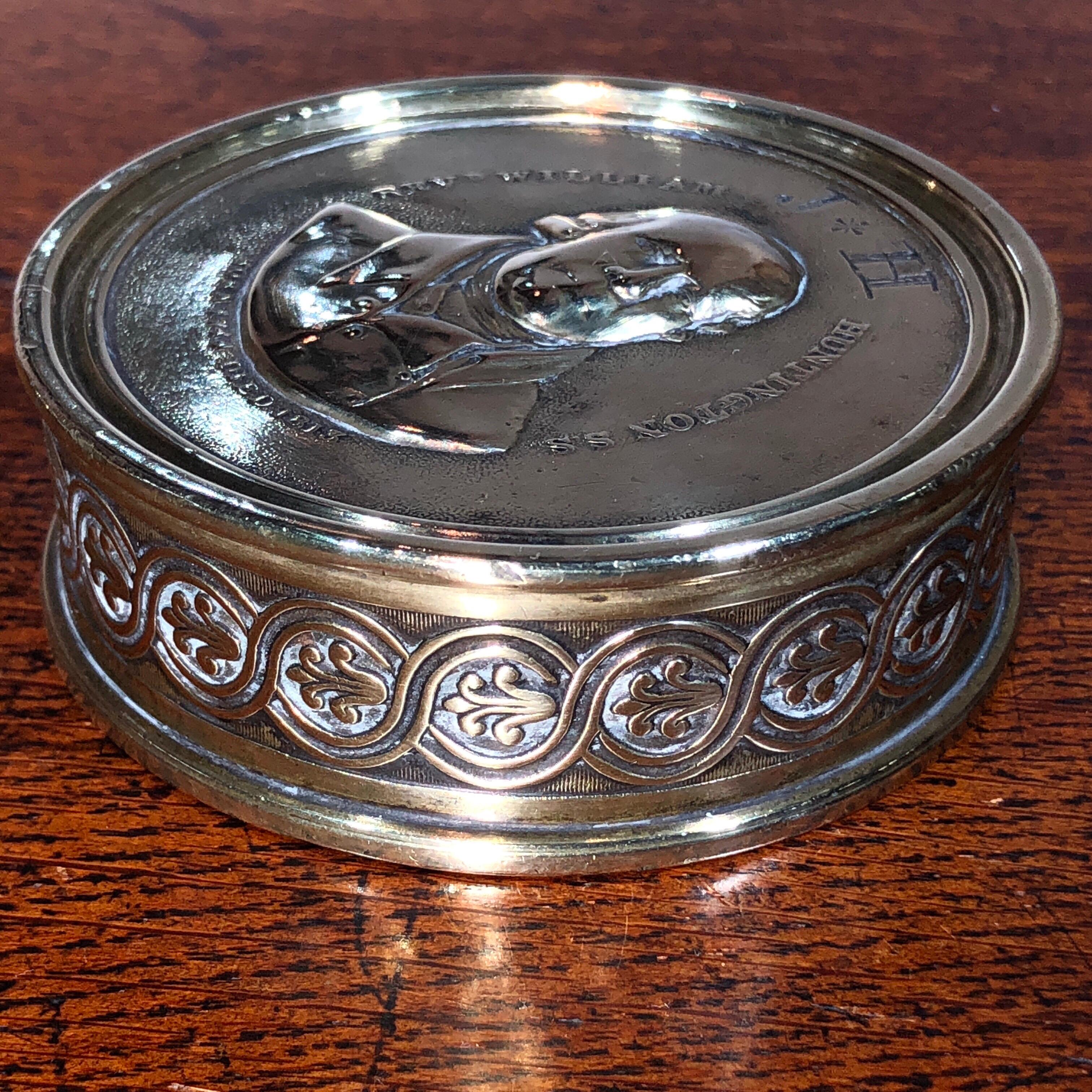 Handsome large brass tobacco box, the lid cast with a depiction of a clergyman, titled ‘REVd WILLIAM HUNTINGTON S.S. BORN 1744 / DIED 1813’ , also hand-engraved ownership initials J*H , the sides case with a Regency anthemion twist,
circa