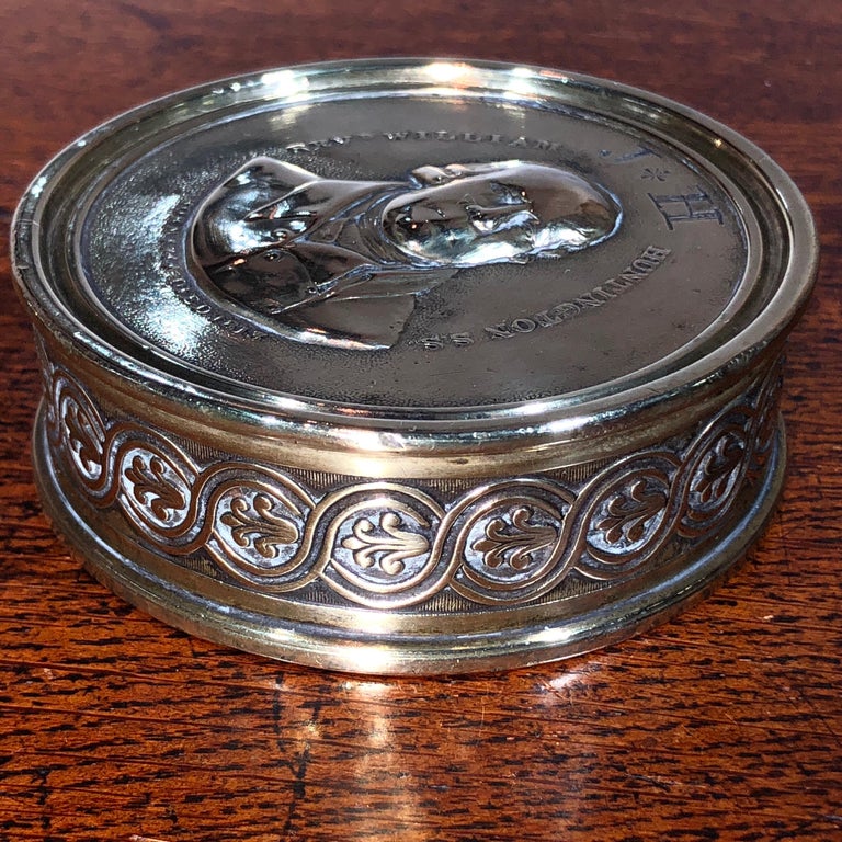 Handsome large brass tobacco box, the lid cast with a depiction of a clergyman, titled ‘REVd WILLIAM HUNTINGTON S.S. BORN 1744 / DIED 1813’ , also hand-engraved ownership initials J*H , the sides case with a Regency anthemion twist,
circa