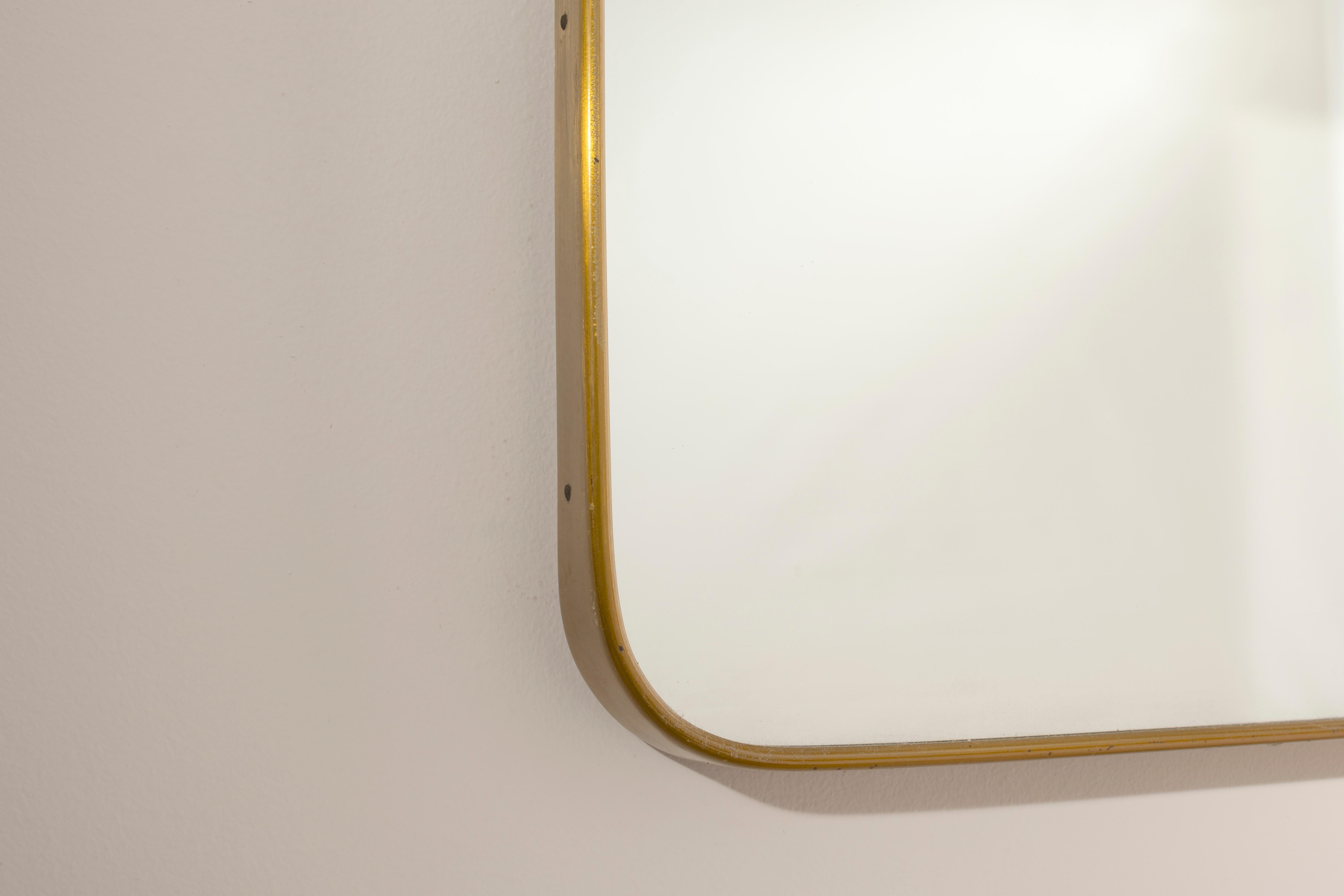 Italian Large brass wall mirror with integrated lights, Italy, 1950s For Sale