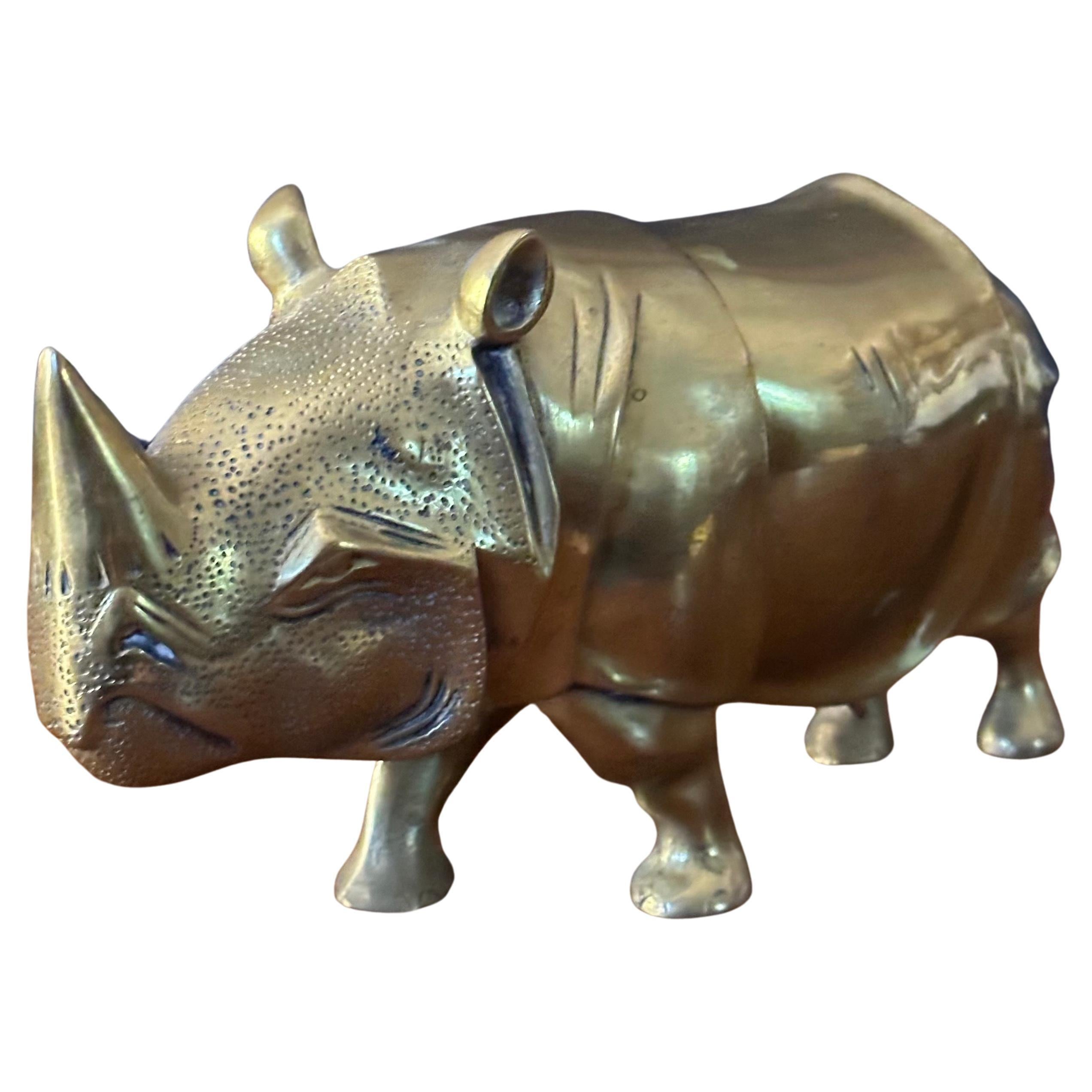 Large brass white rhino / rhinoceros sculpture, circa 1970s.  The sculpture is in very good condition with great detail and measures 9.5