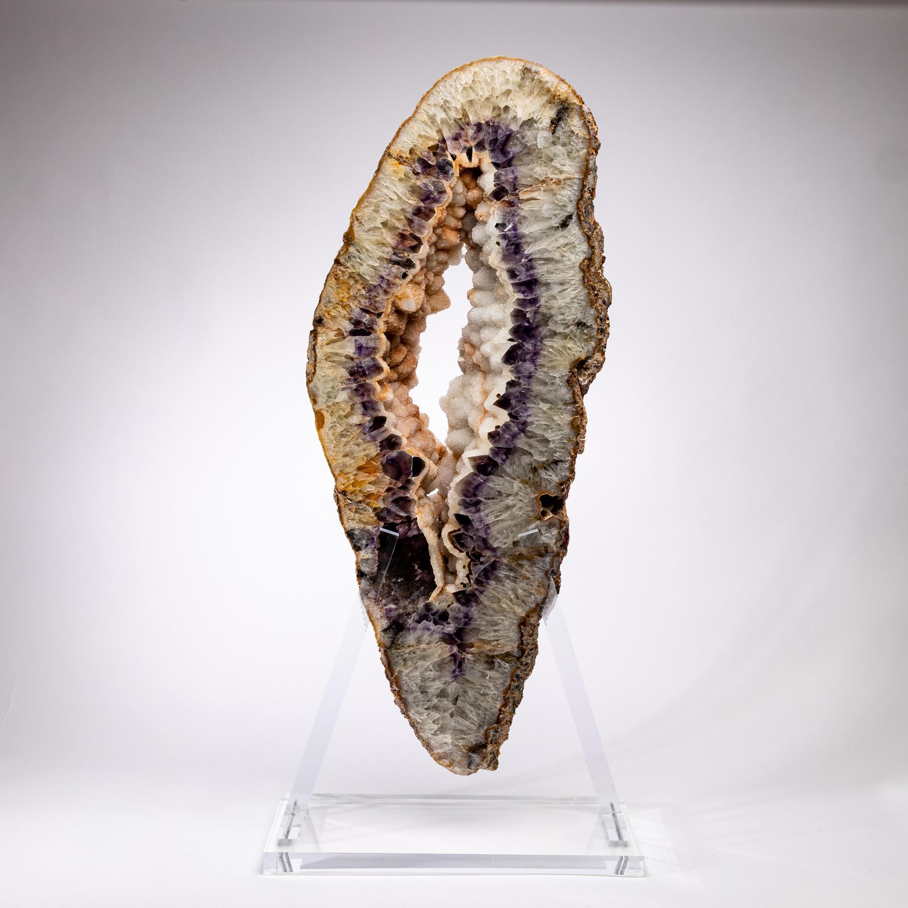 This amethyst/ agate slab is from Brazil and has a combination of colors with hints of purple, white, grey and brown.
Agates are formed in rounded nodules, which are sliced open to bring out the internal pattern hidden in the stone. Their formation