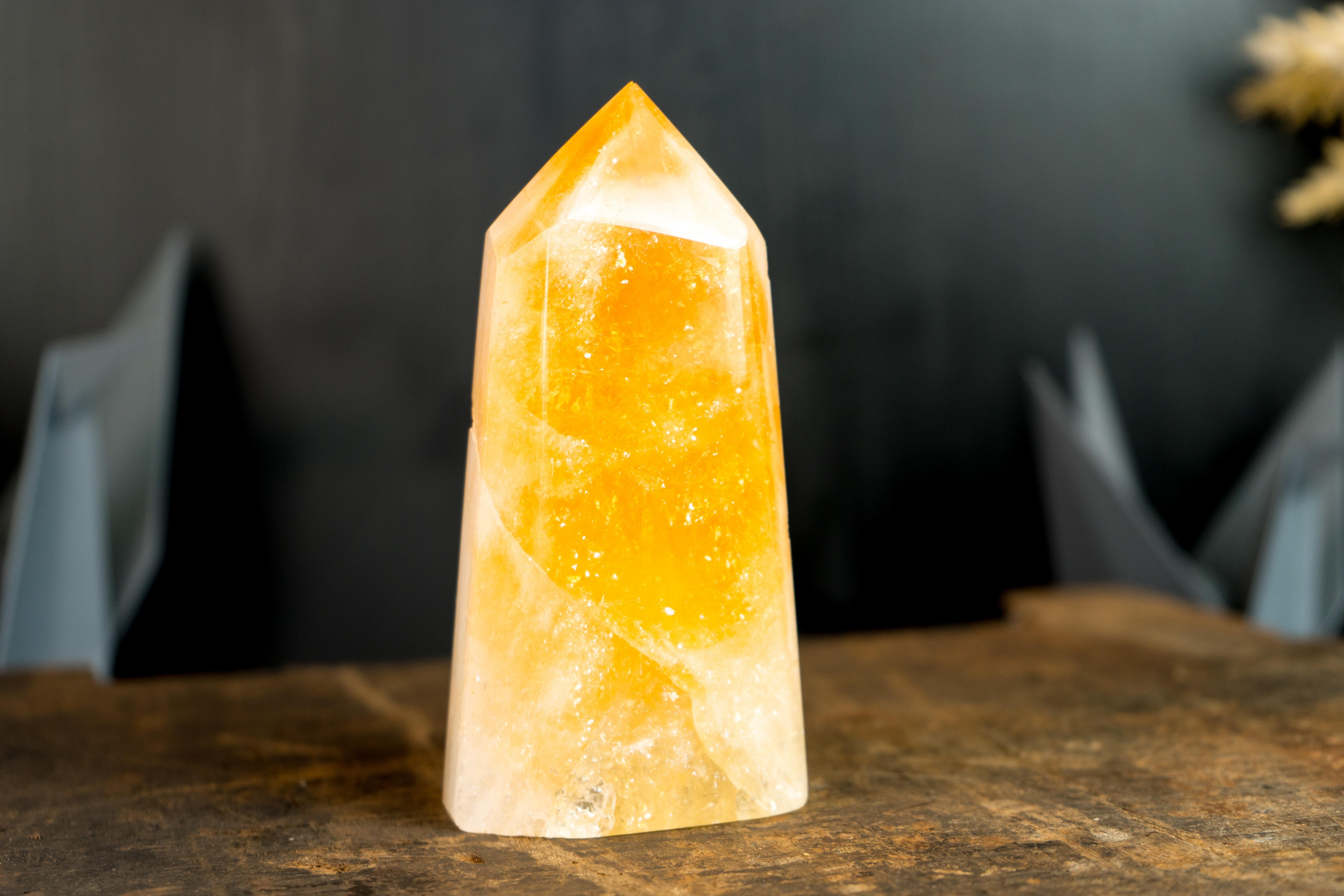 With remarkable beauty, hand-made work and aesthetics, this Citrine Point Generator was meticulously cut and polished to showcase a perfect blend of natural beauty and responsible mining. A Citrine Obelisk that makes a valuable addition to your