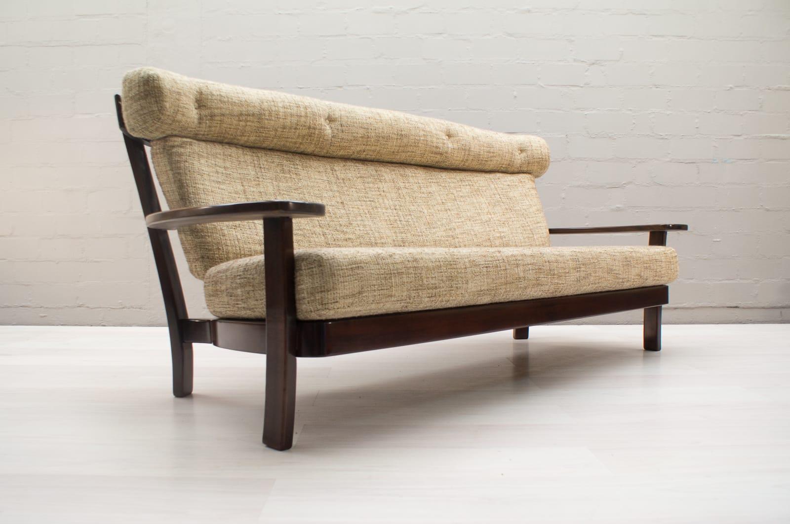 Sofa, rosewood, Brazilian design, European execution, 1960s. The sofa set is still in the original upholstery fabric. Altogether a very good condition.

This settee is executed in Brazilian rosewood and fabric and holds several well-constructed