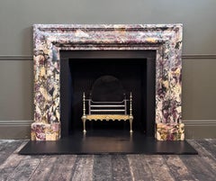 Large 'Breccia de Vendome' marble bolection fireplace mantel by Ryan and Smith