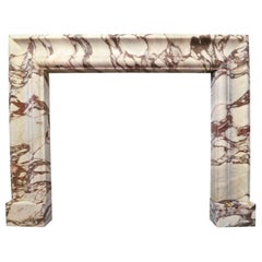 Grande cheminée à boudin en marbre Brèche Violette