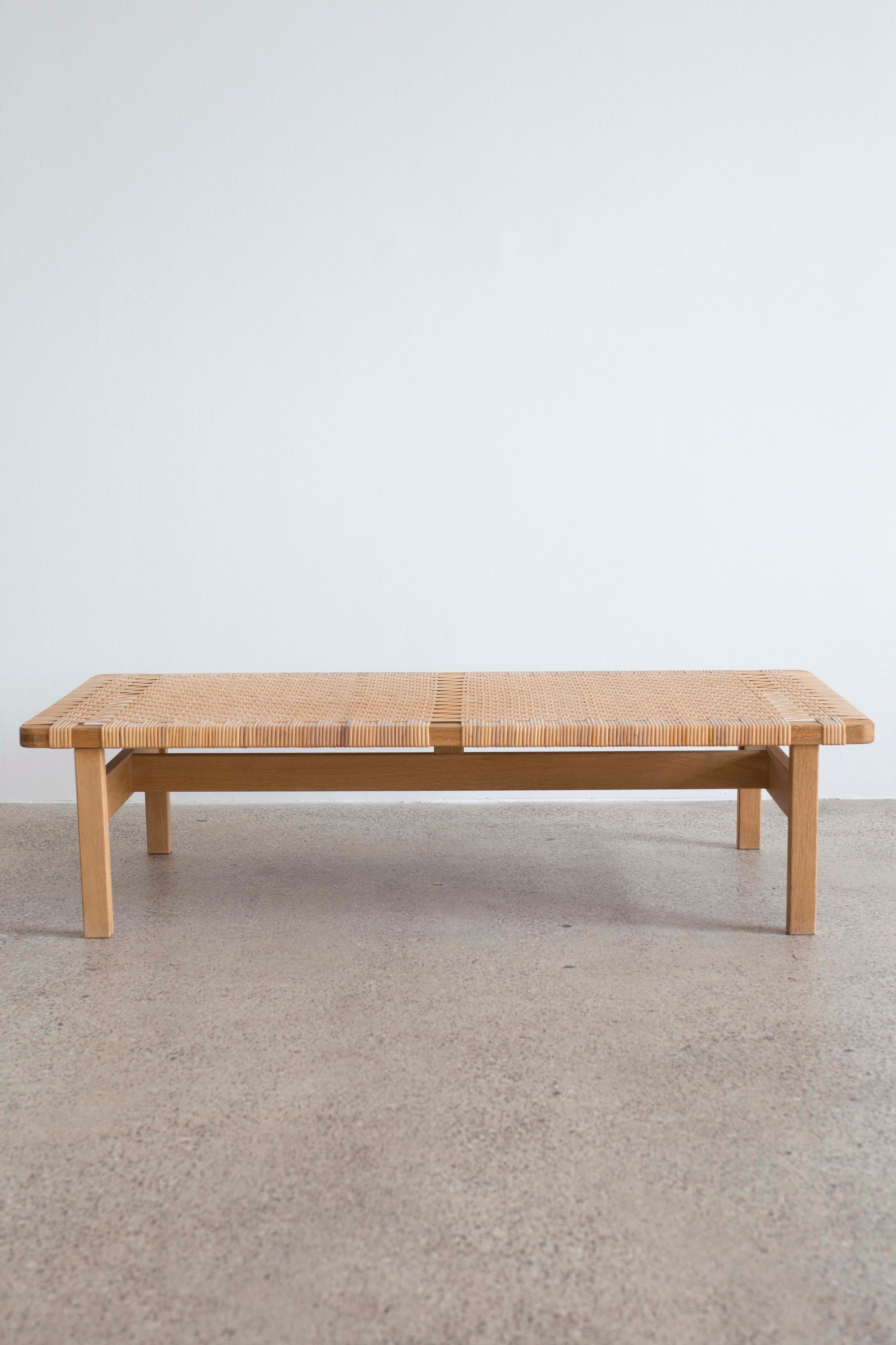 Rare large version of the Børge Mogensen bench. Original patinated oak and woven cane.

Designed by Børge Mogensen 1955 and made at Fredericia Stolefabrik, Denmark.