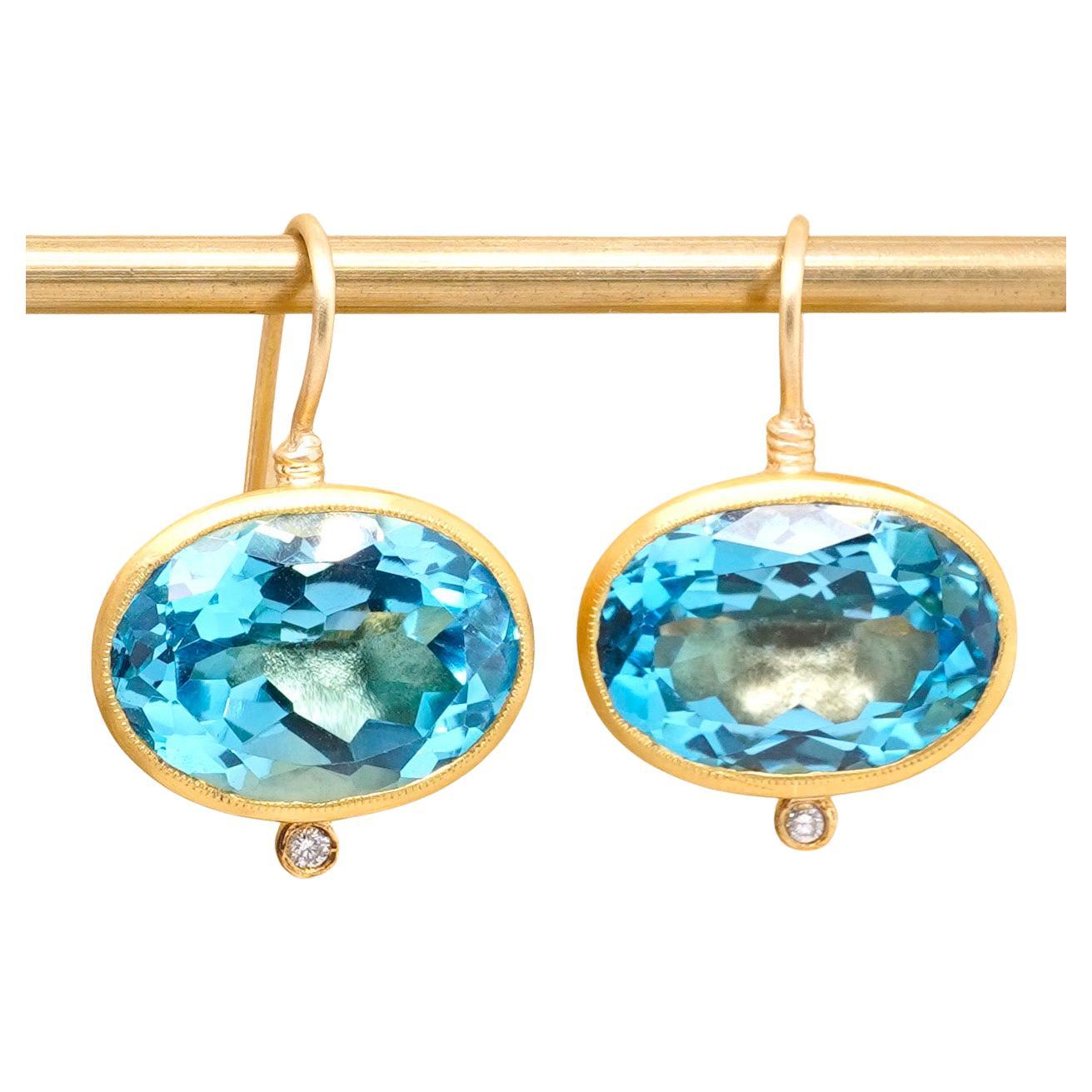 Large, 22.15 ct Bright, Oval, Blue Topaz, Earrings with Diamond Detail, in 24kt Gold by Prehistoric Works of Istanbul, Turkey. Measurements: Total Length, 24mm (.9