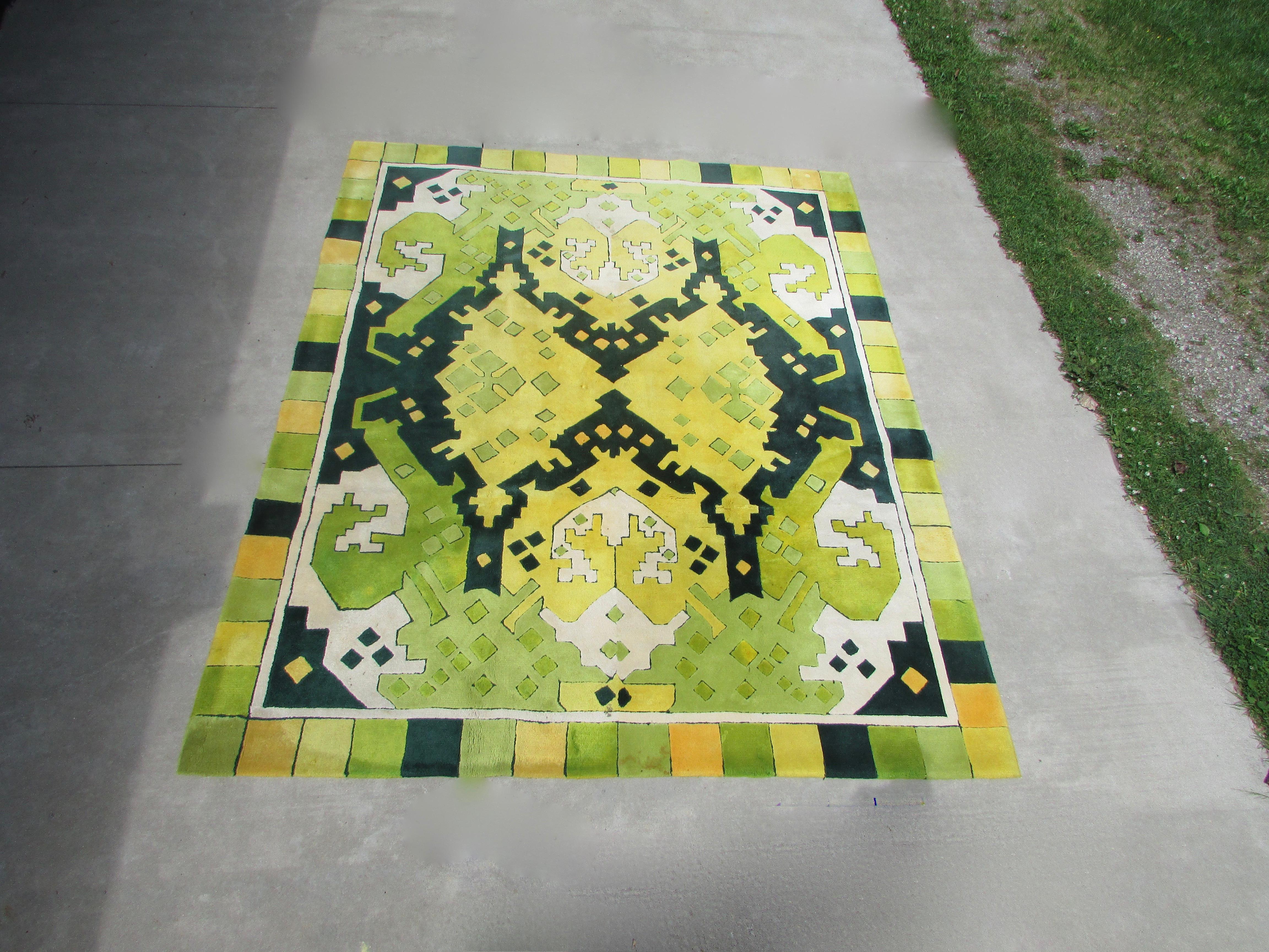 Large fun wool rug in lime green, dark green, yellow with white colors. A few minor spots shown.