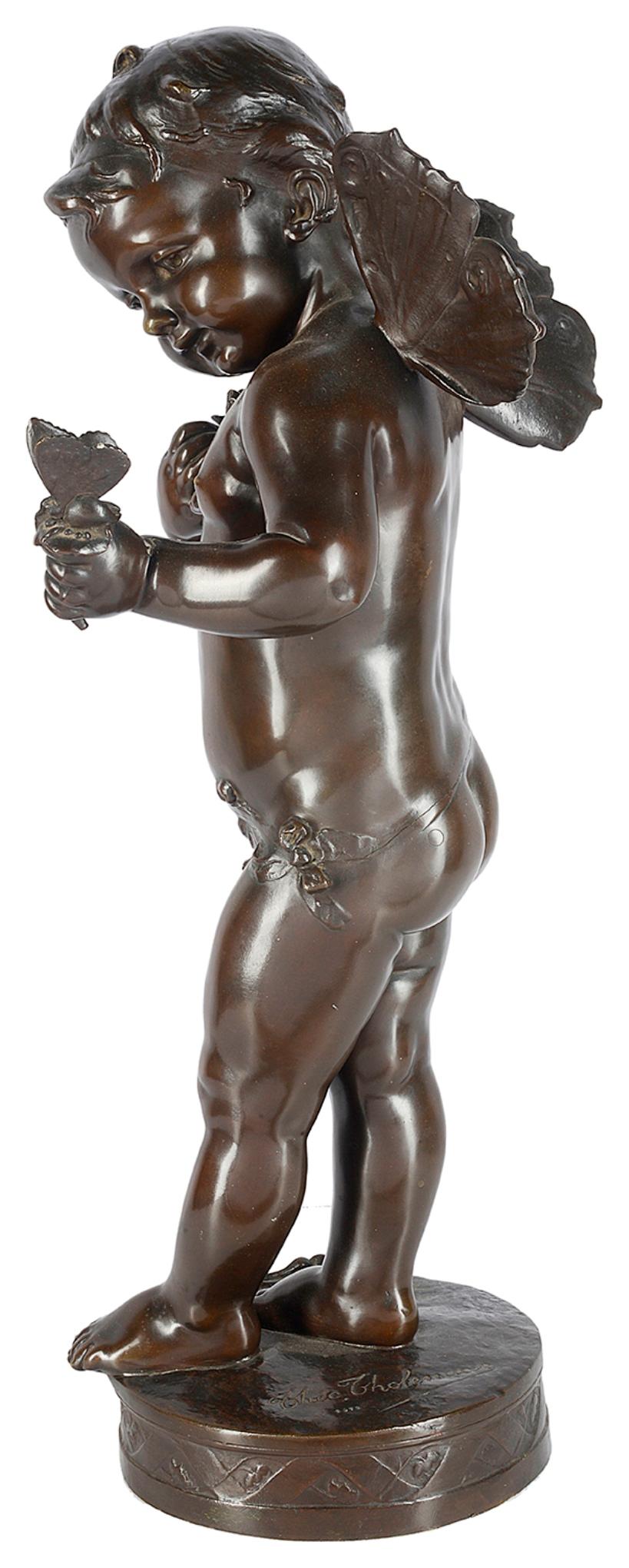 A very good quality large 19th century bronze statue of cherub holding a butterfly.
 
