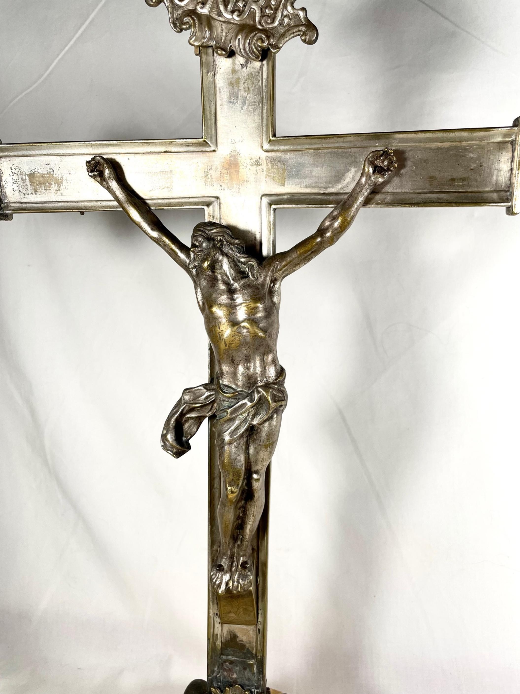 Large Bronze Altar Crucifix 19th Century After Giambologna of Florence.

This antique silvered bronze crucifix is a rare and beautiful devotional object. Cristo Morto, the figure of Christ, is cast in bronze after a model by Giambologna