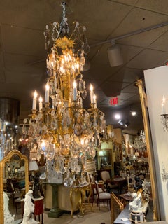 Large bronze and crystal chandelier with sixteen lights