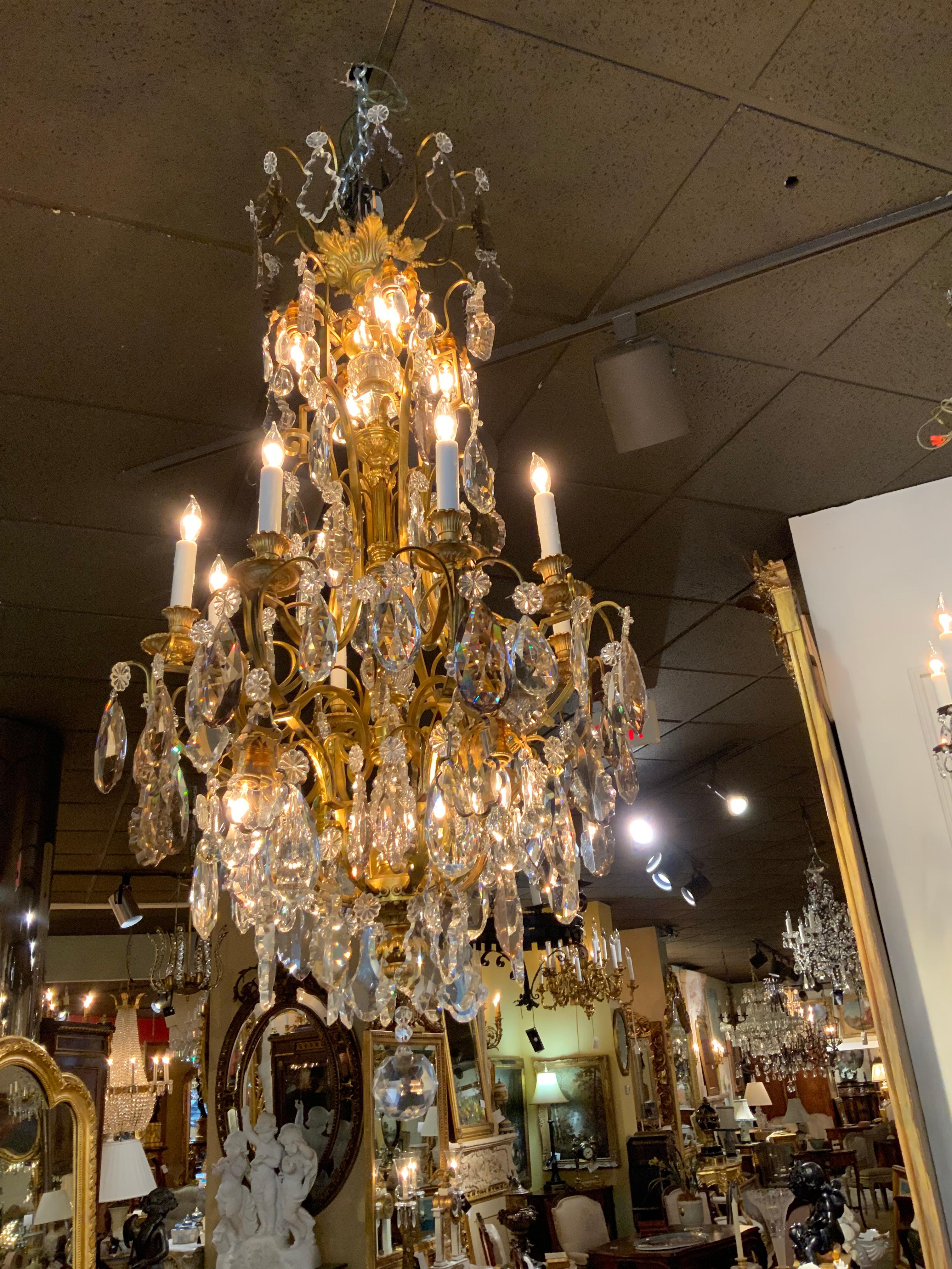 Large bronze and crystal chandelier with sixteen lights In Excellent Condition For Sale In Houston, TX