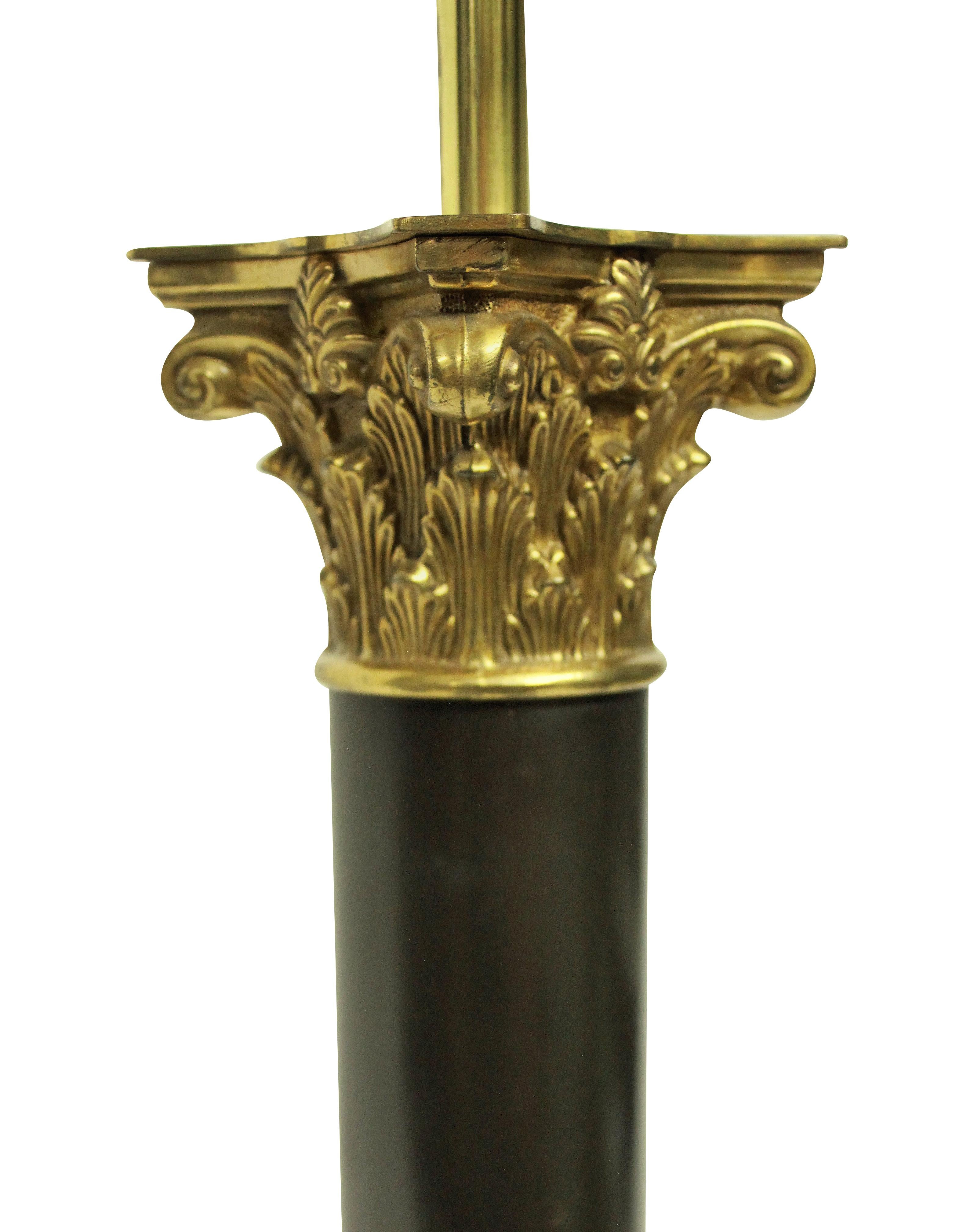 A large English bronze and ormolu column lamp in the Regency manner, made for 10 downing street, where several of these lamps can be found.