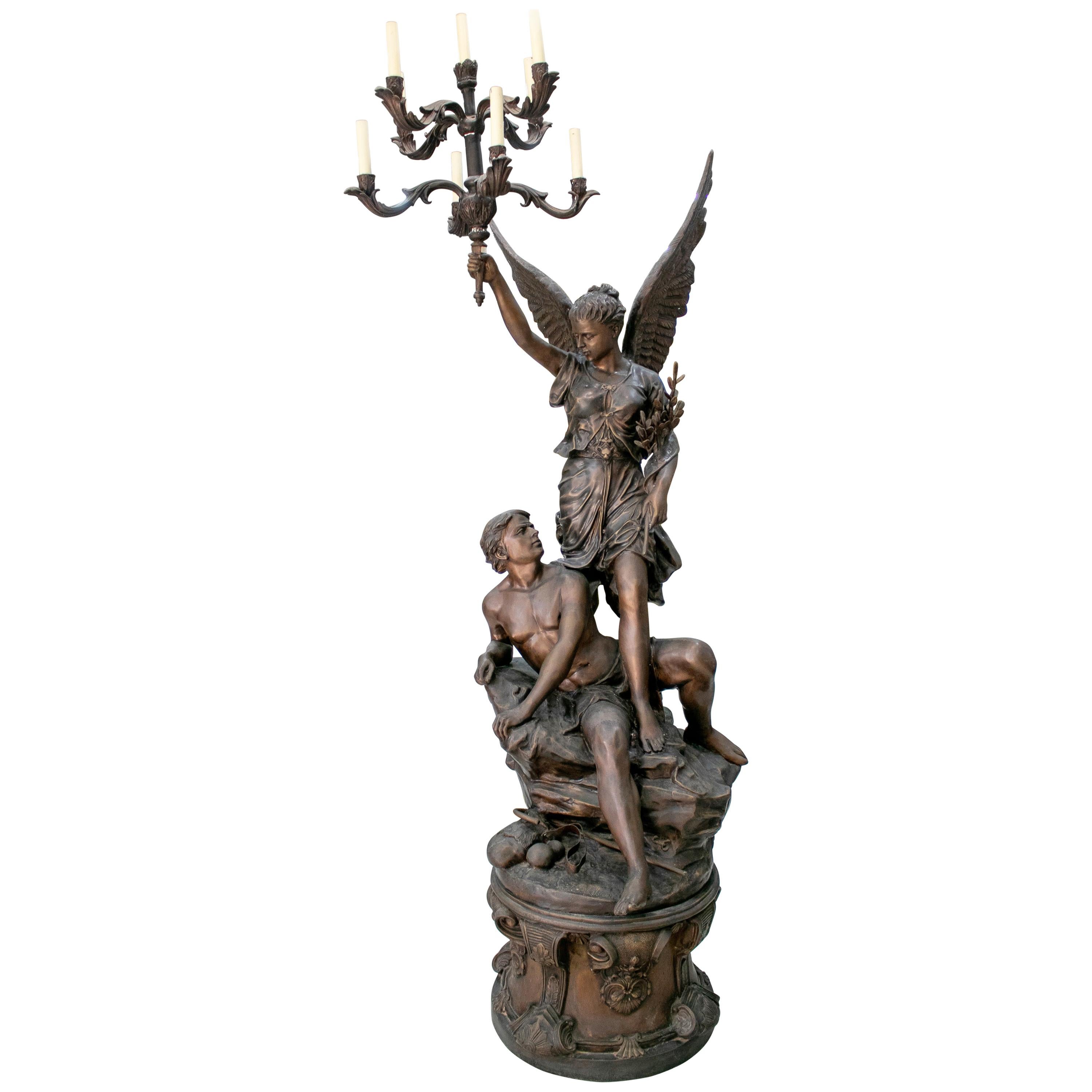 Grande candelabro in bronzo Annunciazione con angelo e pastore a 8 bracci firmato S. Keliam