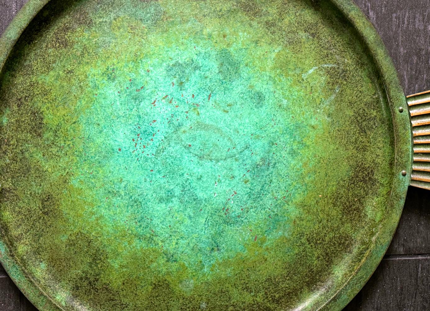 A rare and impressive work by Carl Sorensen -- who maintained a workshop in Philadelphia in the 1910s and later worked for Walt Disney in the late 1920s and 1930s -- this large bronze tray features a glowing, gorgeous verdigris finish that ranges