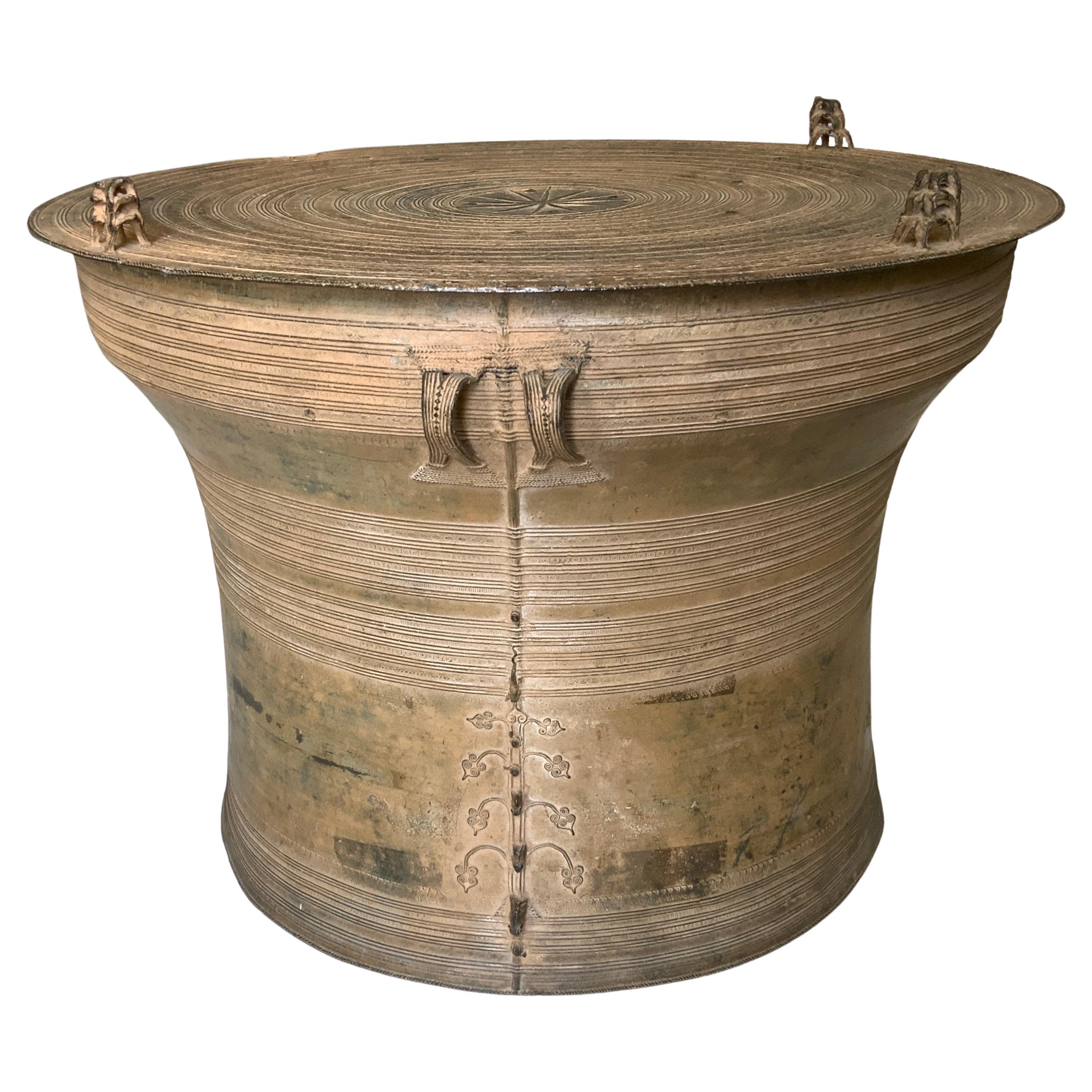 A beautiful and large Southeast Asia patinated original Bronze rain drum. 
Rain drums was used in Southeast Asian rituals. Their hollow Bronze shape transforms the sound of monsoon rains into music. This drum features detailed loop handles on sides