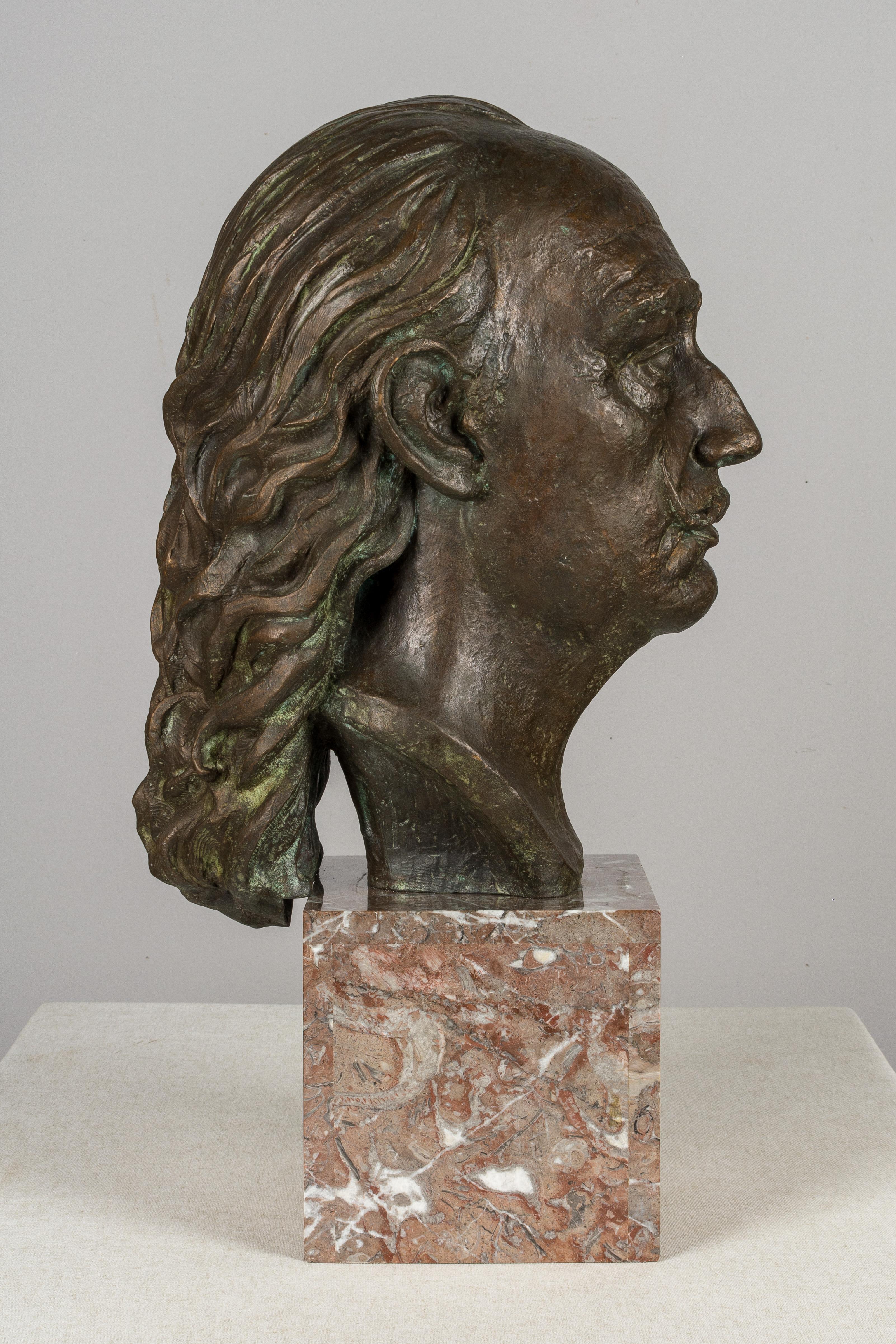 A large cast bronze bust of Surrealist artist Salvador Dali by Spanish sculptor Raimon Casals i Alsina (Barcelona 1922-), circa 1986. One of 9 copies. At present, a copy can be seen at the Abelló Museum in Mollet. On a Languedoc marble base. Total