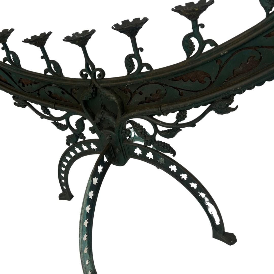 Large standing bronze candelabra with heavy patina throughout

Very fine details and cutouts

11 candle holders

Free Standing
