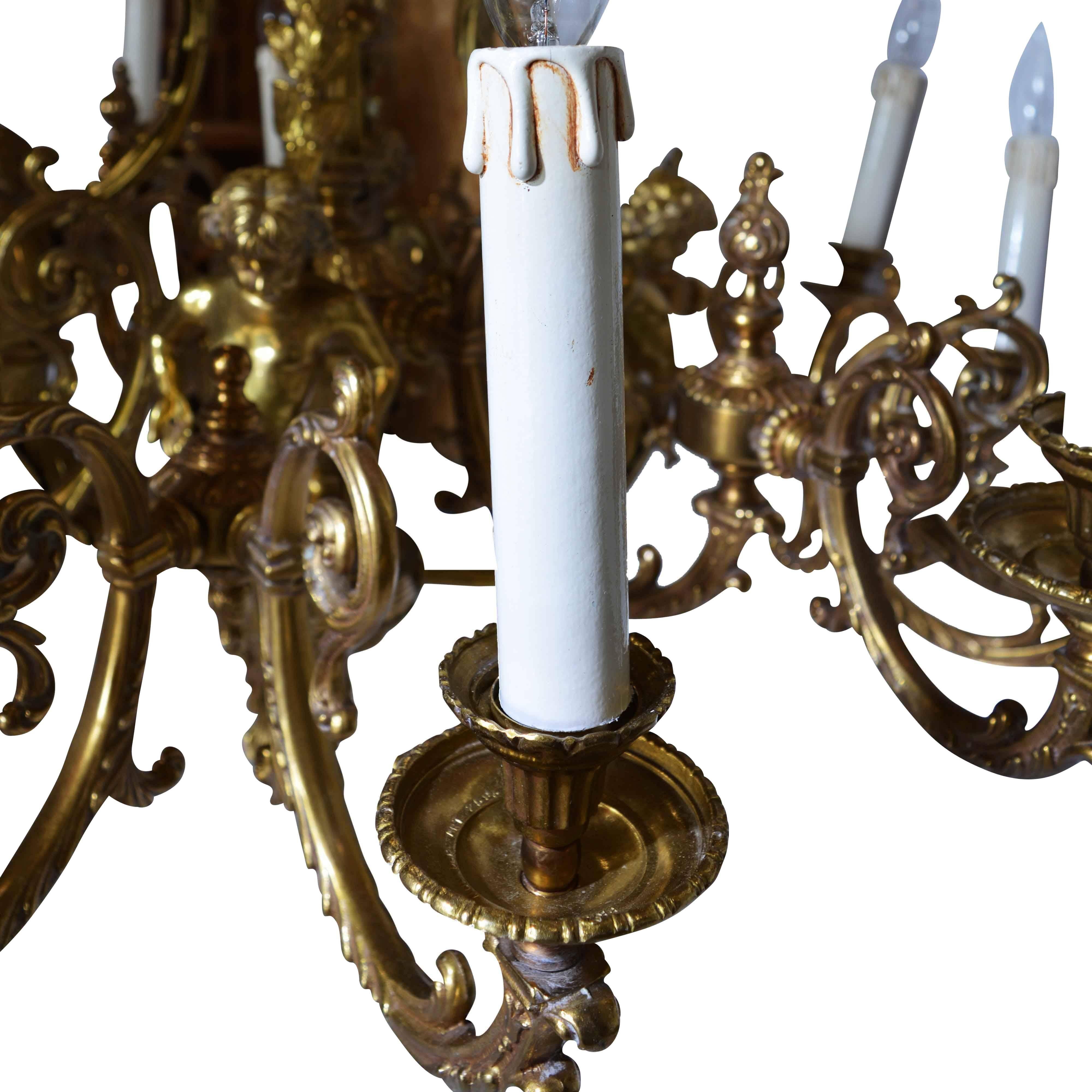 There is just something about the cherubs that adorn the arms of this bronze chandelier that is sure to bring a warm glow to any room. The centre column is marked with the Italian manufacturer’s mark – FBAI. They create amazing lights and this one