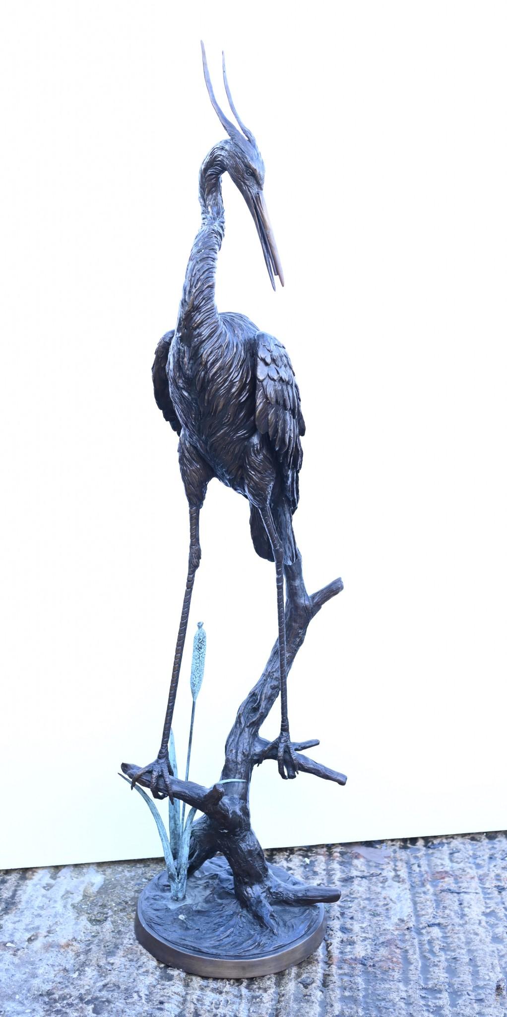 Gorgeous casting of a bronze crane statue
This works as a fountain, the water goes up inside and will emerge from the mouth of the bird between the beak
Good size - over four feet tall - 132 CM
Well cast look at how the birds feathers have been