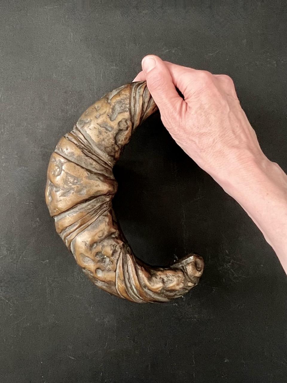 Large and heavy cast bronze door handle in the shape of a croissant. Wonderful for your bakery, patisserie, coffee shop, café or kitchen. Mid to late 20th century, European. Good vintage condition with minor signs of wear in line with age and