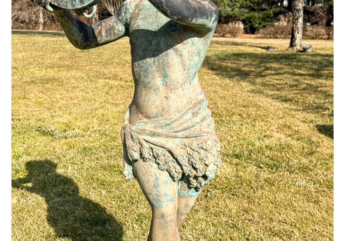 XX secolo Grande scultura da giardino in bronzo di un giovane neoclassico con tamburello in vendita