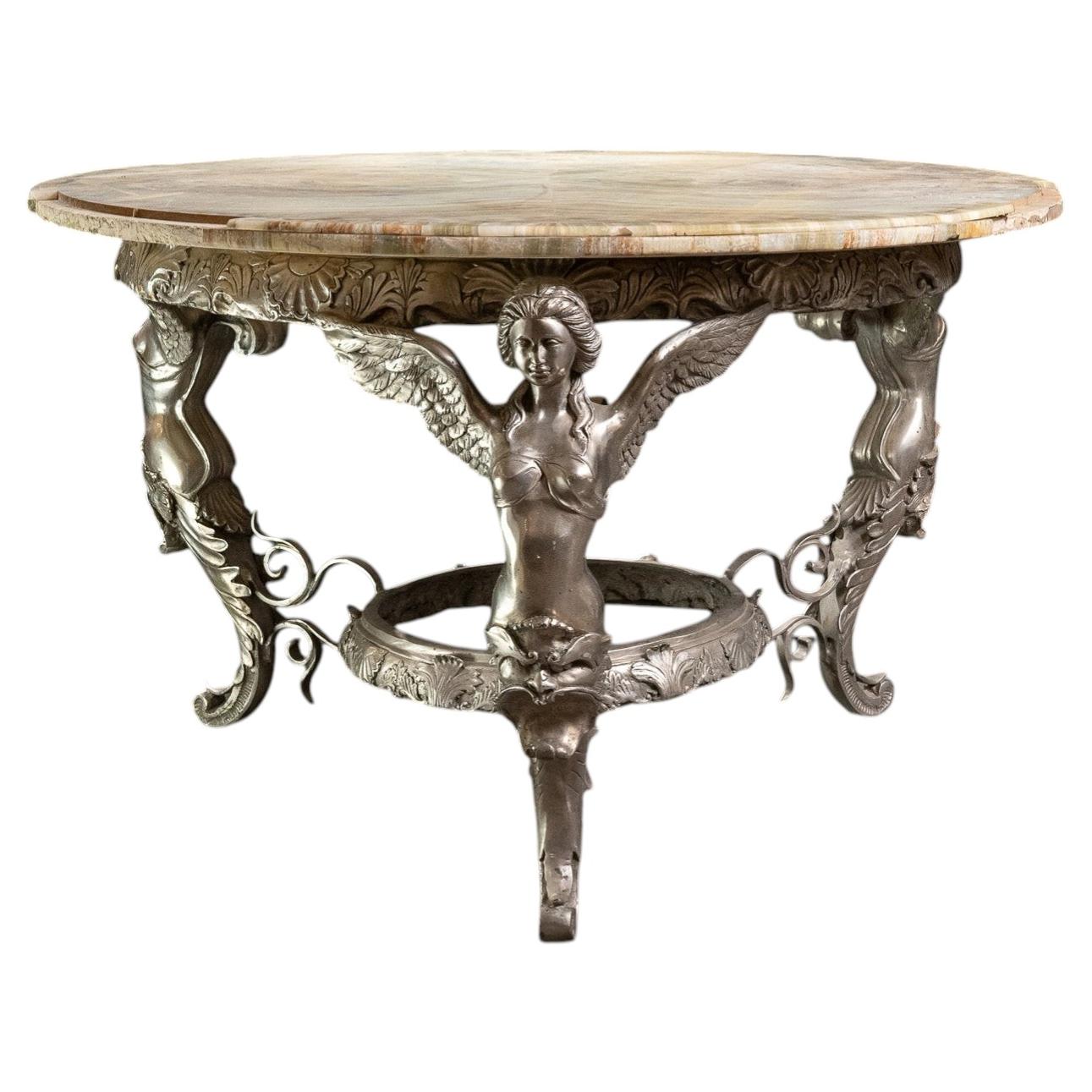 Large bronze gueridon with an onyx top