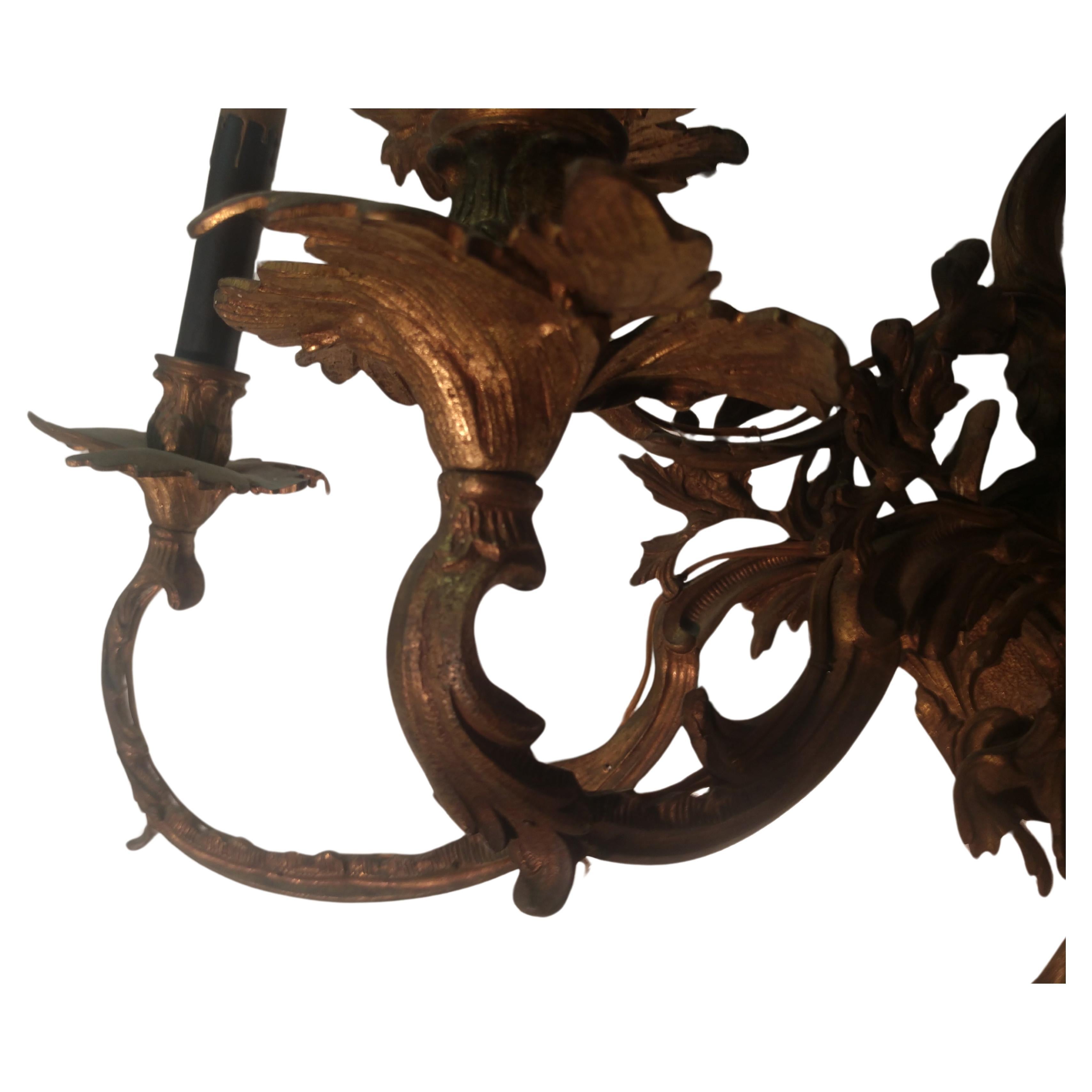 Large bronze 7-light wall sconce which can be hard wired or plugged into a socket. Great bronze casting with no issues. In excellent vintage condition with minimal age related wear. Great for a entryway.