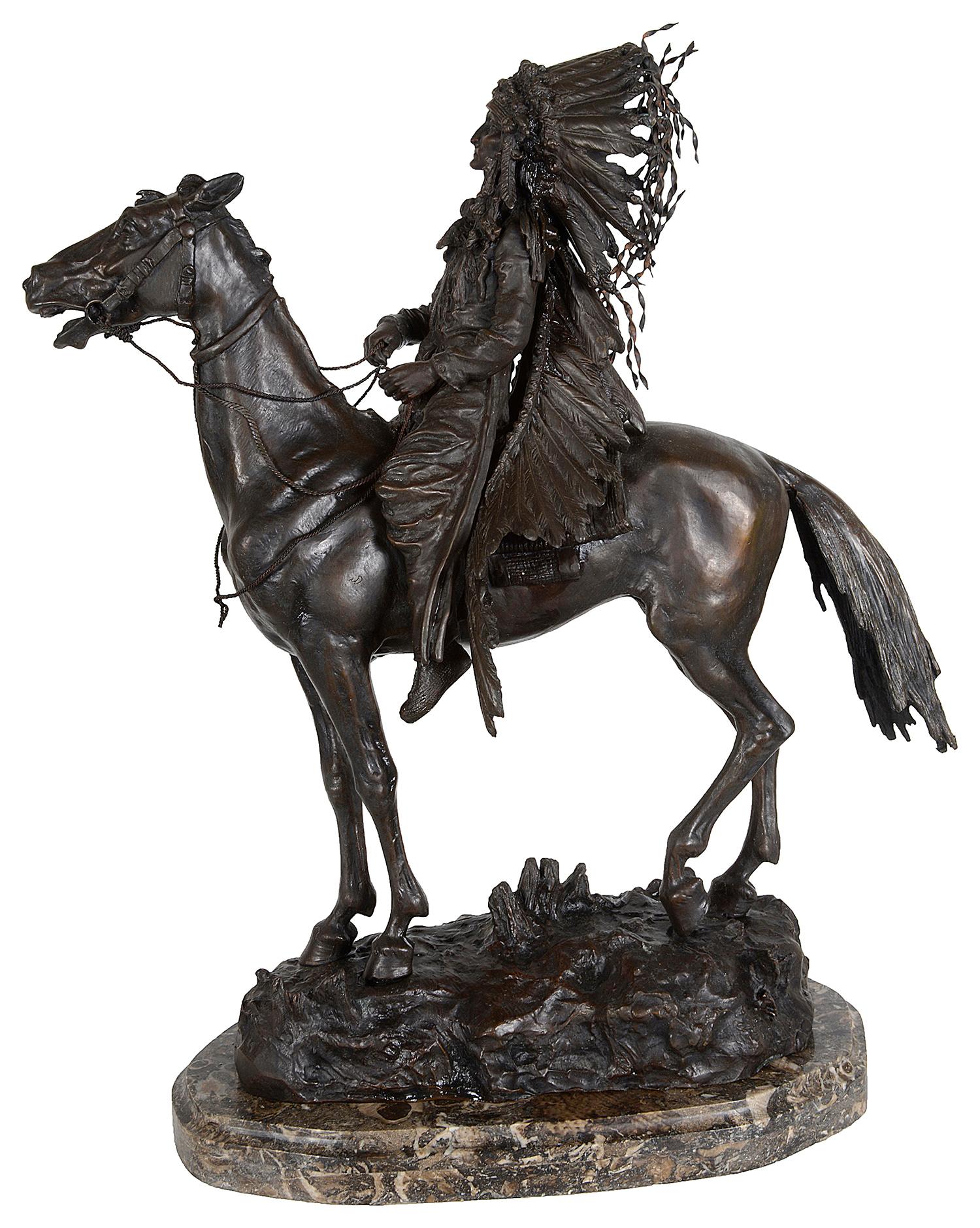 A wonderfully impressive and fine quality bronze statue of a Native American Cherokee Indian on horseback.
Signed; Carl Kauba. (Austrian, 1865-1922).