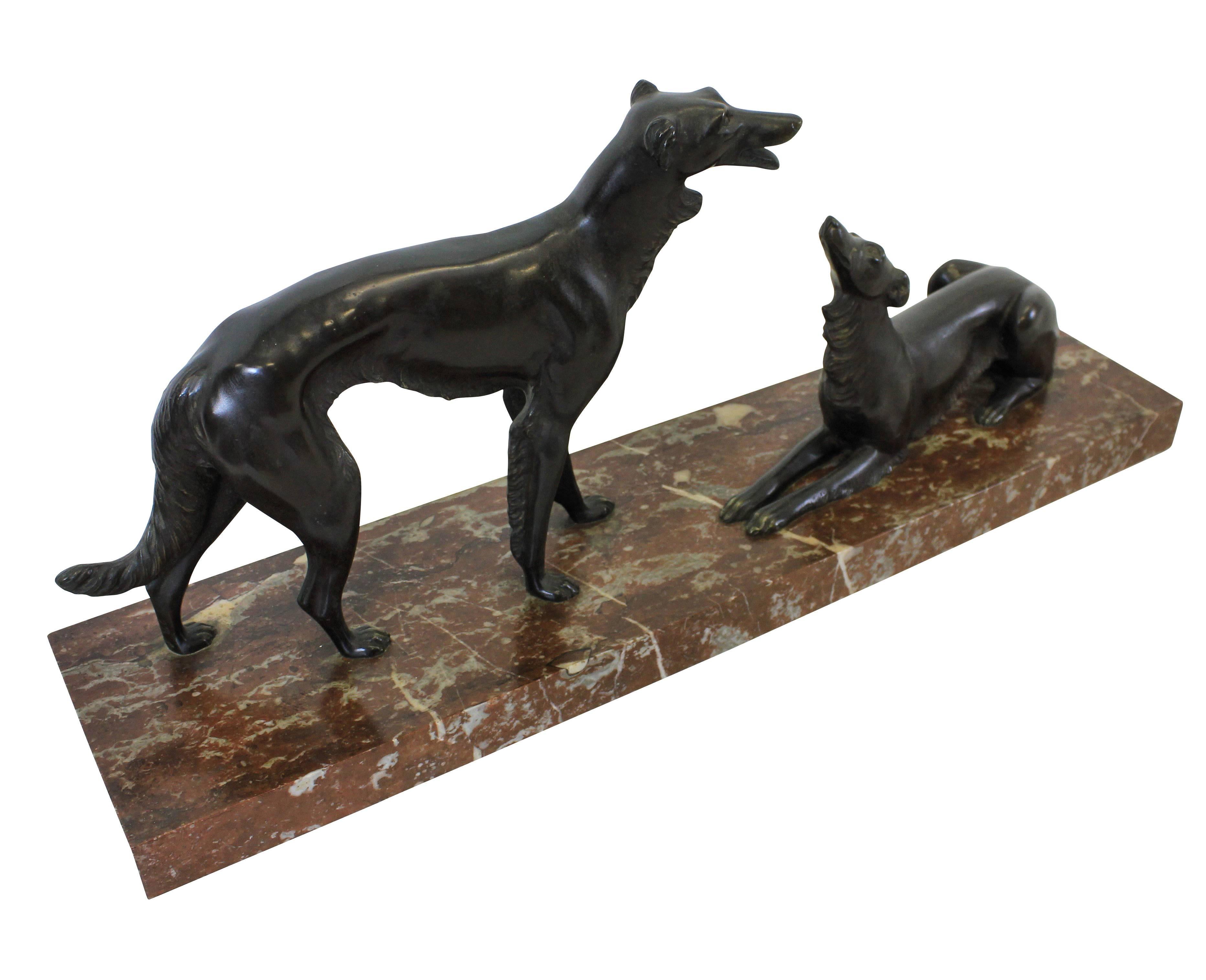 A large French bronze group of two hunting dogs on a rouge marble plinth. With a foundry mark.
 