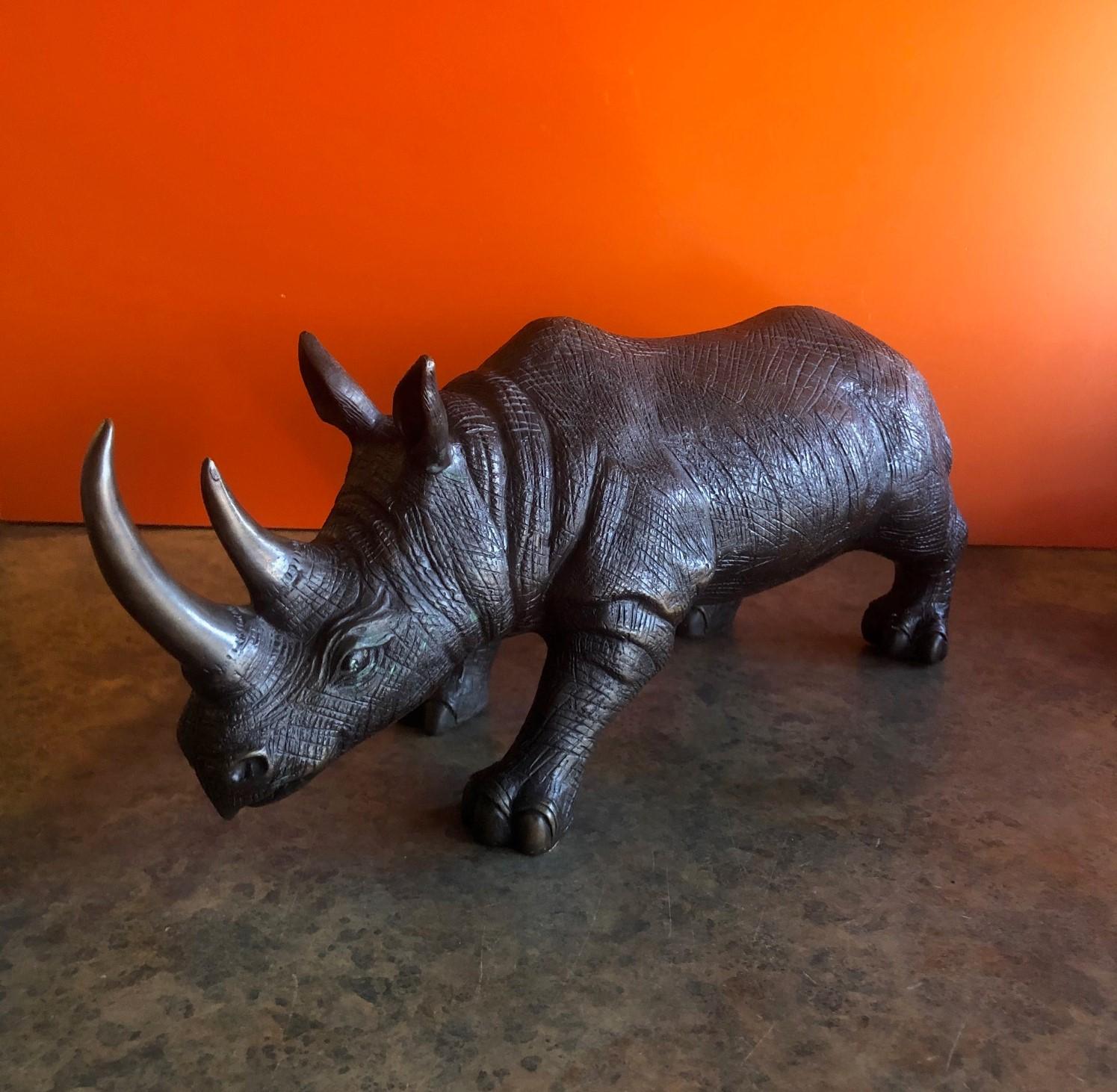 Large bronze rhinoceros / rhino sculpture, circa 1990s. The piece has great detail and patina and measures 20