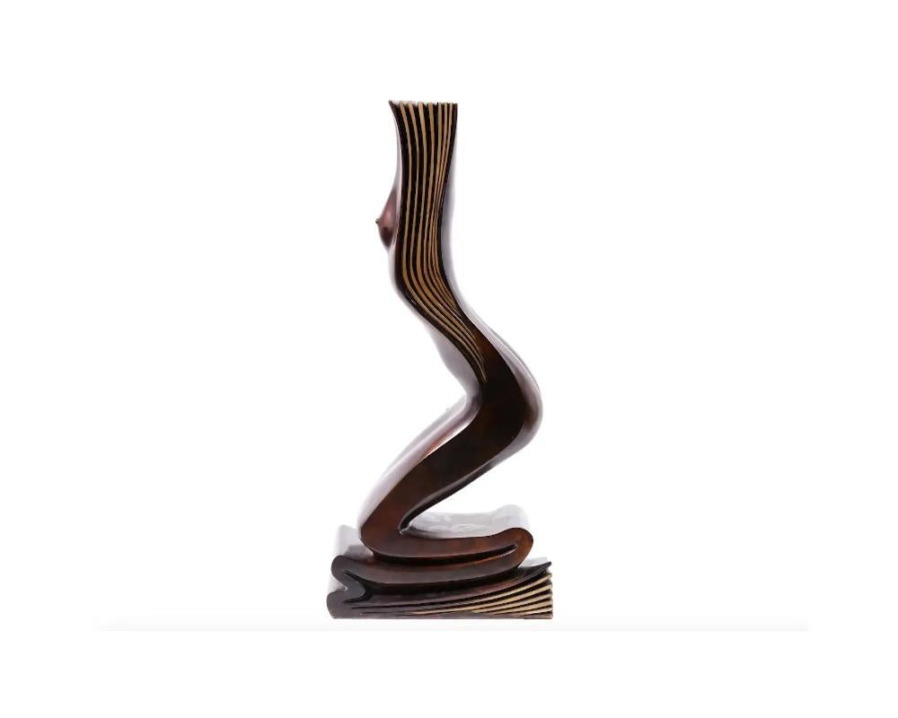 Vea Xiradakis, French, born 1946, a limited edition large bronze sculptural book end depicting a female nude figure. Marked, Chapon Paris, on a base. Signed, Xiradakis, and numbered 2 of 8, on the base. Vea Xiradakis is a multimedia artist, painter,