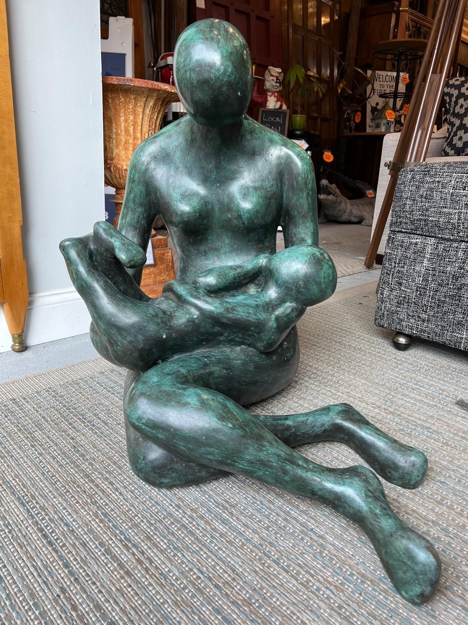 Beautiful large bronze of a Mother and Child by the noted artist Carol Miller. It has a great patina and is signed on the base Carol Z and dated 74. Carol Miller was born in Los Angeles but went to live in Mexico and became a  free-lance travel