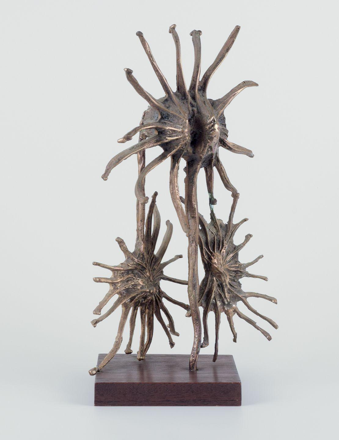 Pre-owned goods are exempt from import duties for U.S. customers. 
Therefore, no import tariffs will be applicable to your purchase.

Large bronze sculpture. Solid bronze. Surrealist, in the style of Dali.
Wooden base. 
Dating: Ca. 1970s. 
No mark