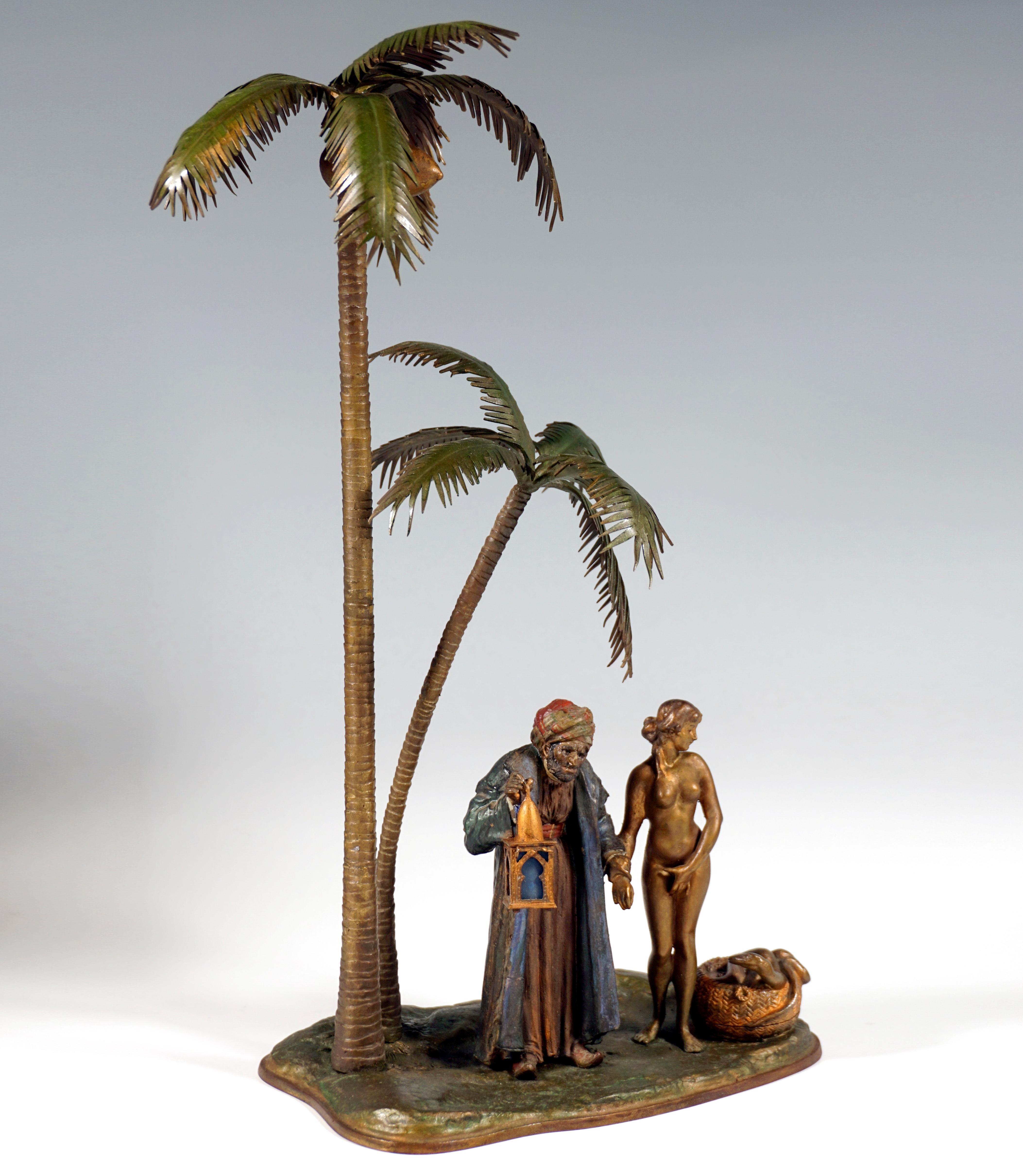 Excellent Piece of Viennese Bronze Art:
Elaborately detailed bronze sculpture of a slave trader with a girl under palm trees:
Old oriental man in a long coat and turban in a stooped posture holding a lantern high with one hand, grasping the wrist of