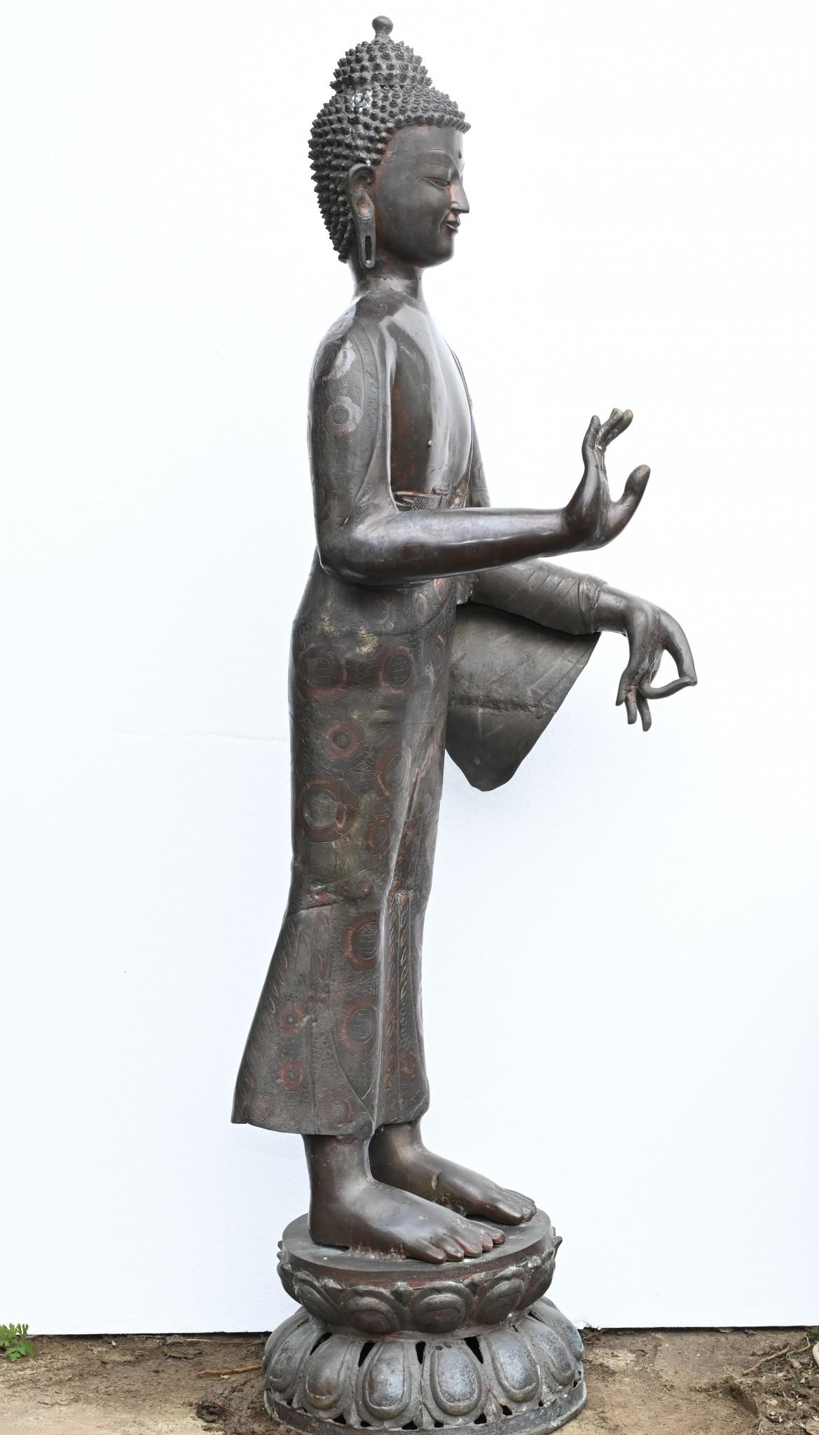 You are viewing a gorgeous standing Tibetan buddha statue
Stands in at over four feet tall - 132 CM
Great patina to the bronze
Buddha is in classic Abhaya Mudra pose with hands in the gesture of reassurance and gift giving
Great for adding an air of
