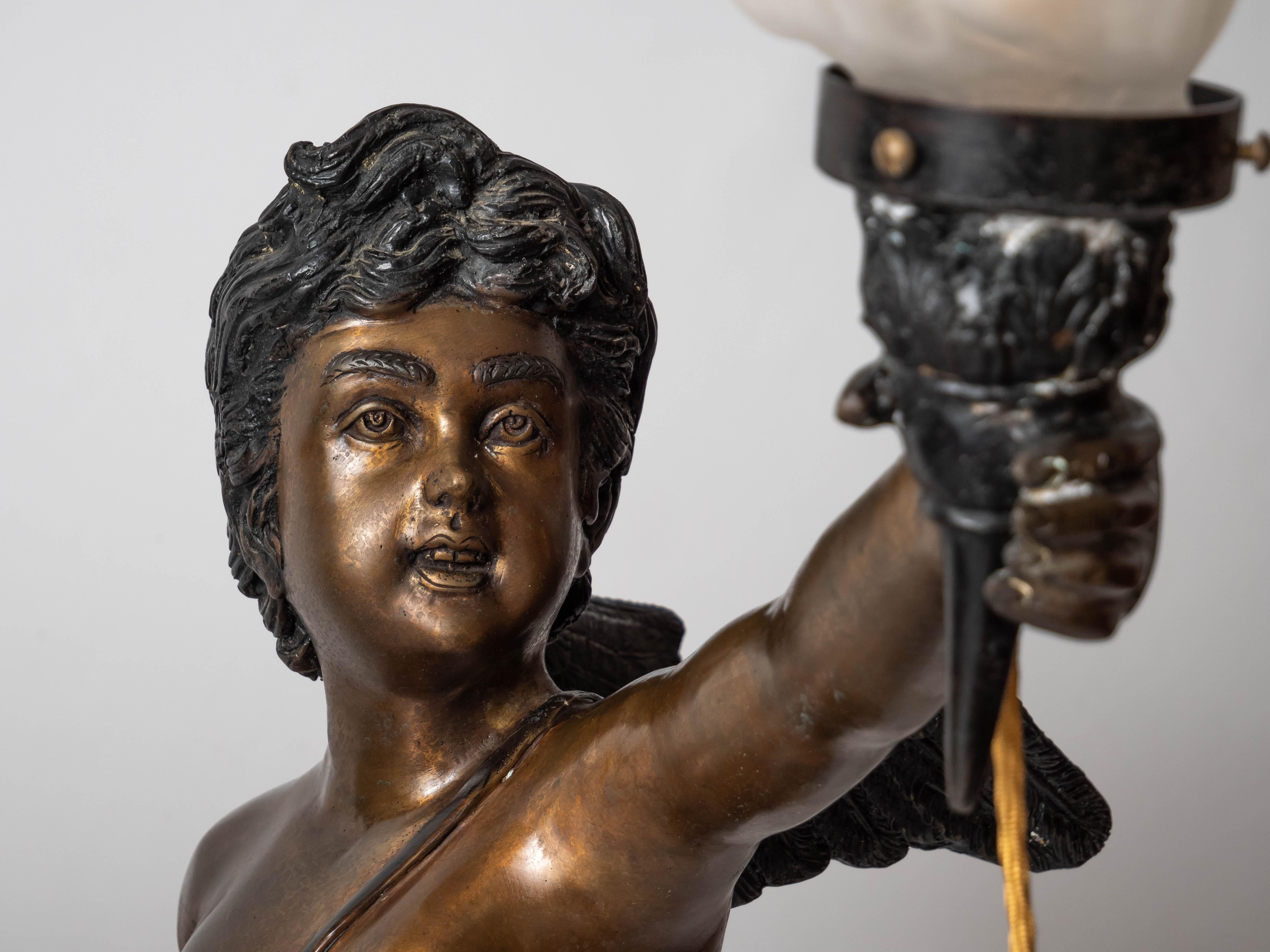 Large bronze statues of Cupids carrying a torch For Sale 11