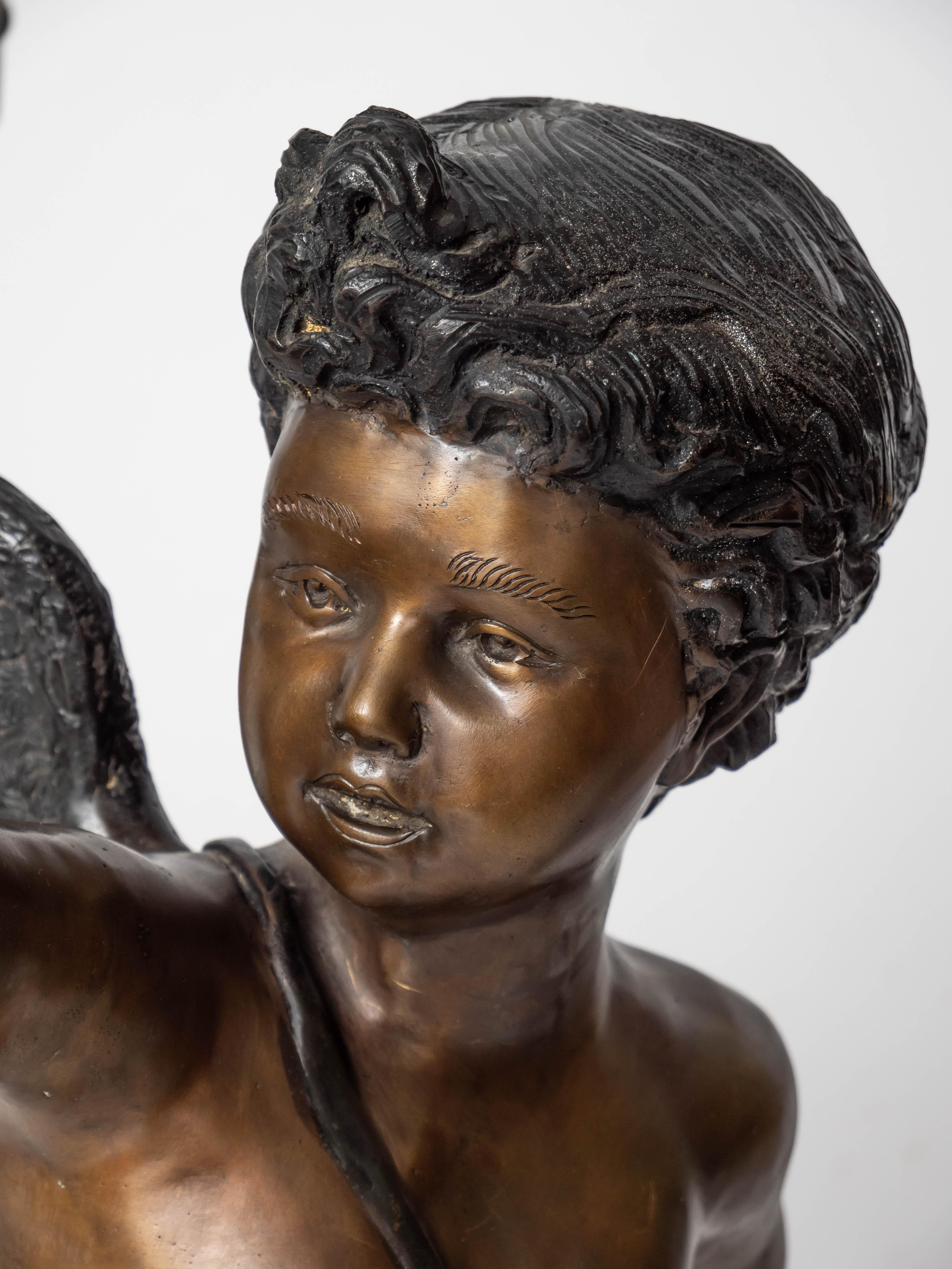 French Large bronze statues of Cupids carrying a torch For Sale