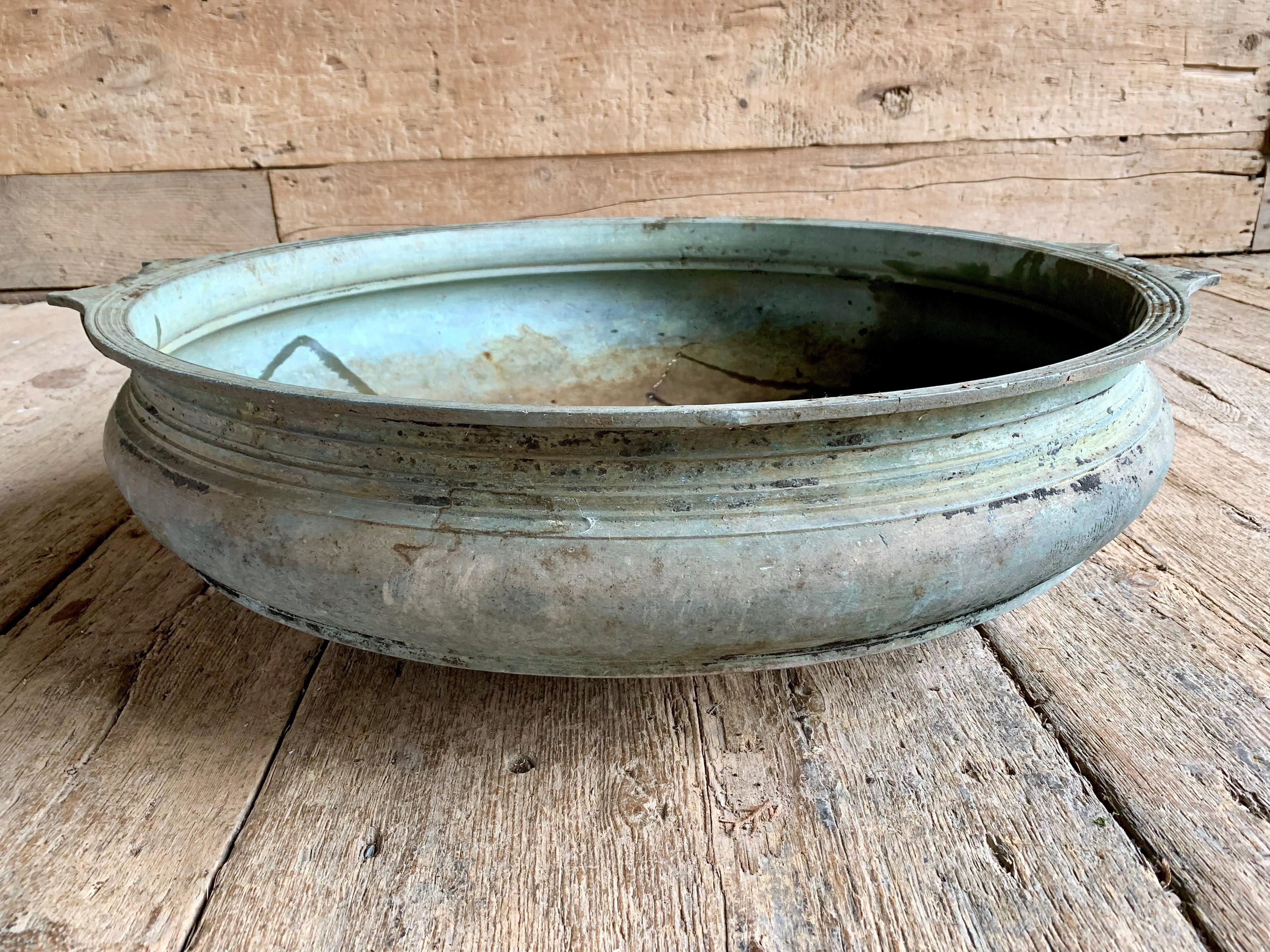 A 19th century large cast bronze bowl-form Urli with handles and a nice patina. 30