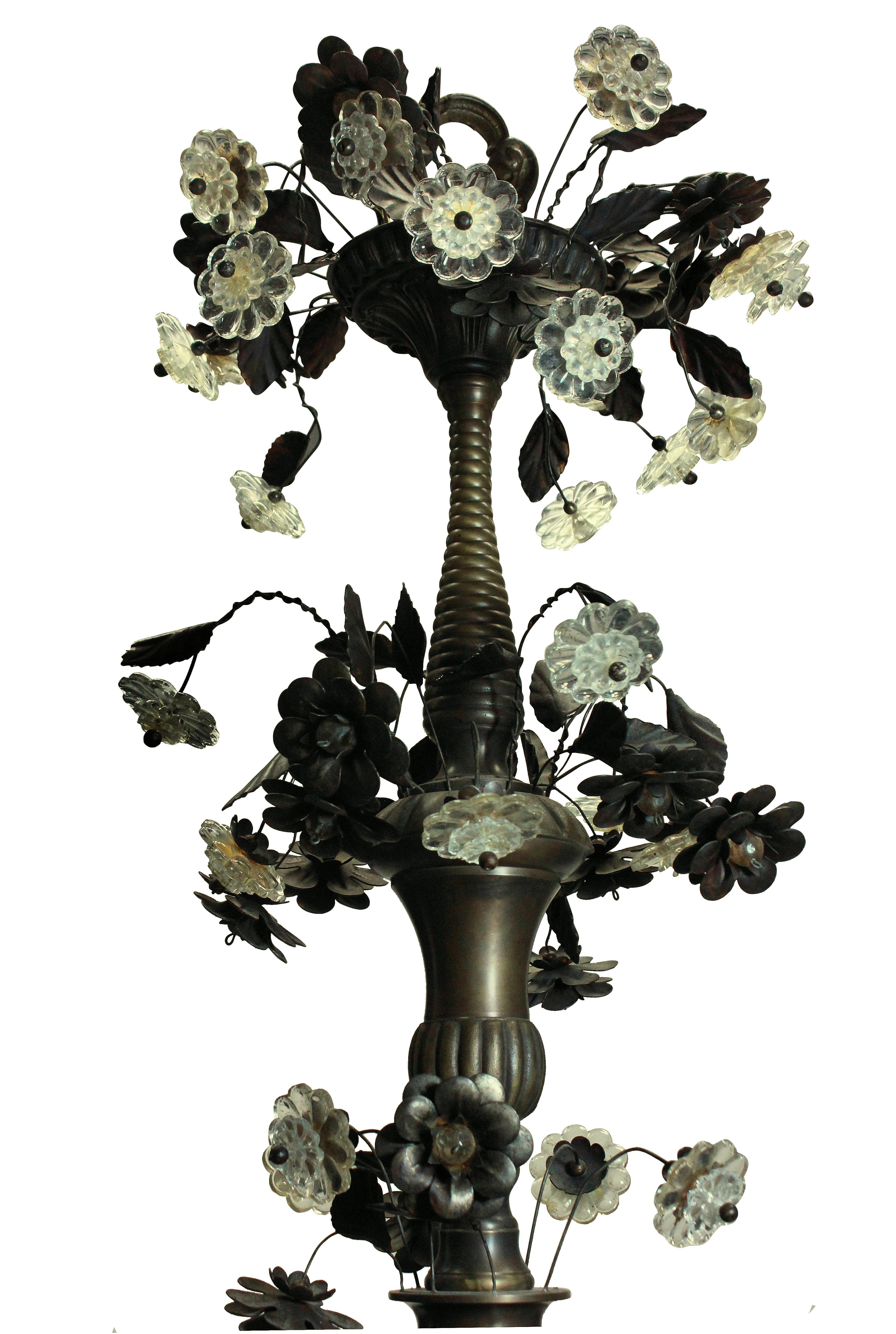 A large English bronzed chandelier of elegant proportions with eight arms, decorated throughout with delicate leaves and cut glass flowers.