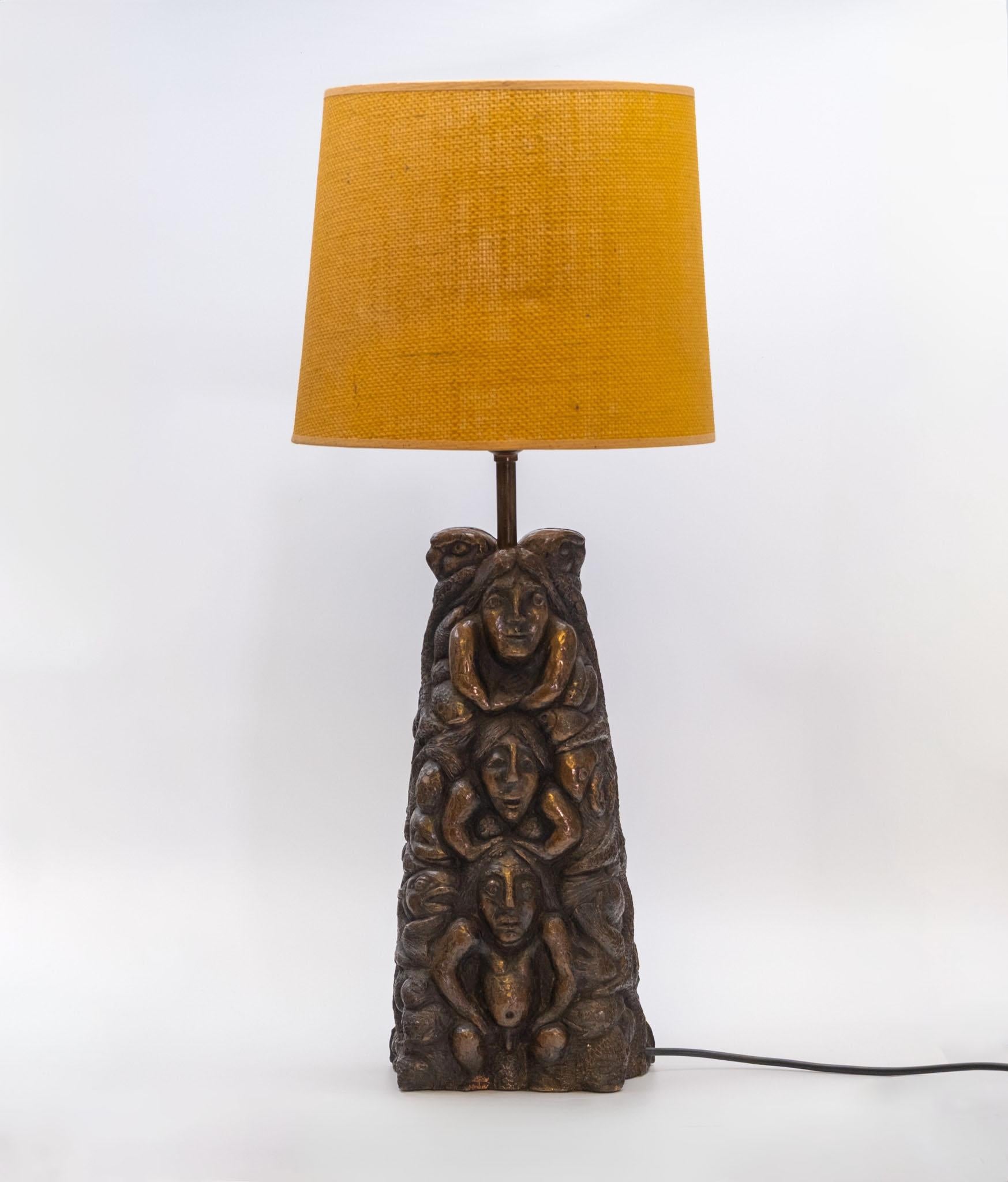 Large totem shaped double sided pottery table lamp. Circa 1970. The lamp has been re-wired with black 
white 3 core and a UK plug added. The cable length is 1.7 metres. 

The pottery has the original bronze highlighting, which is very effective