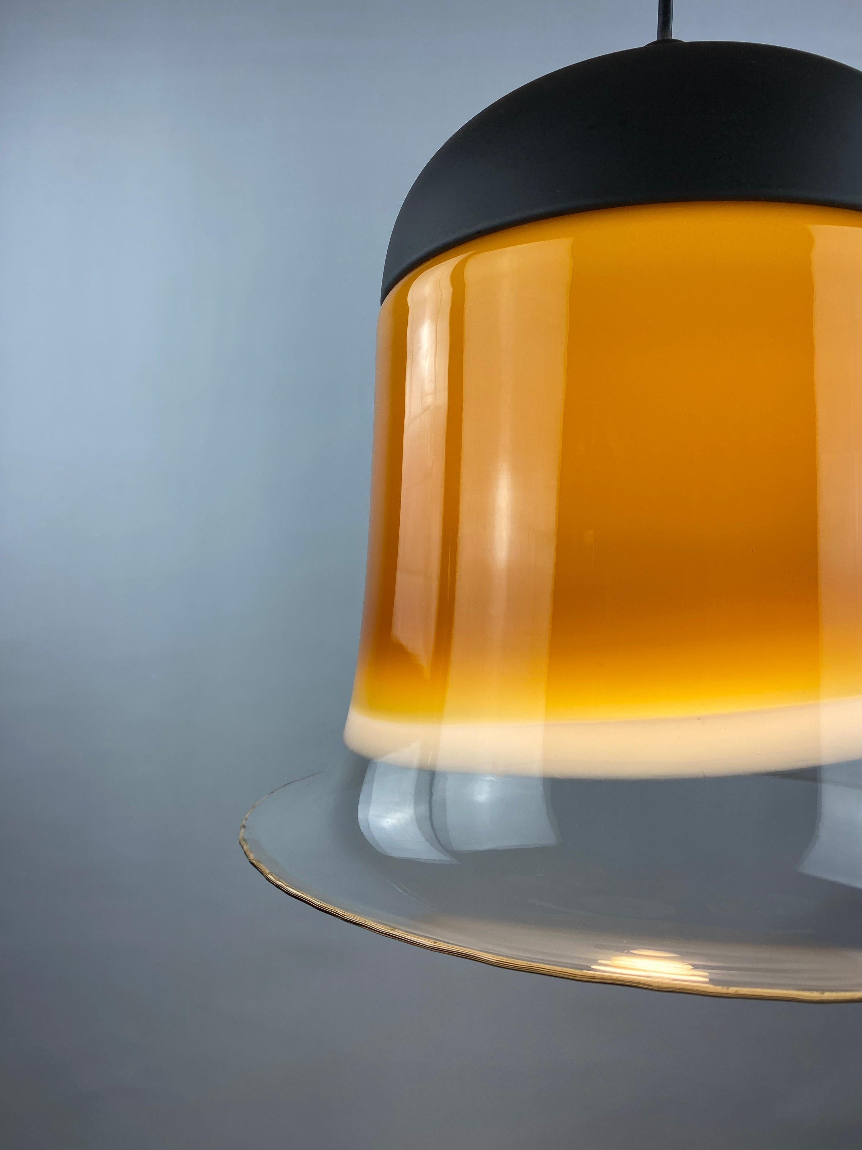 Cool cappuccino colored large glass dome pendant light by Peill and Putzler from the 1970's. Provides beautiful light through the colored surfaces on the glass.

It starts with a clear glass on the bottom which goes to white and then it reaches the